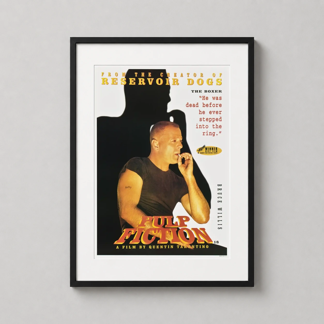 Room mockup of Butch Coolidge Pulp Fiction Bruce Willis The Boxer Movie Poster, displayed as framed wall art in a home theater setting as a portrait print with yellow, red, and white tones.