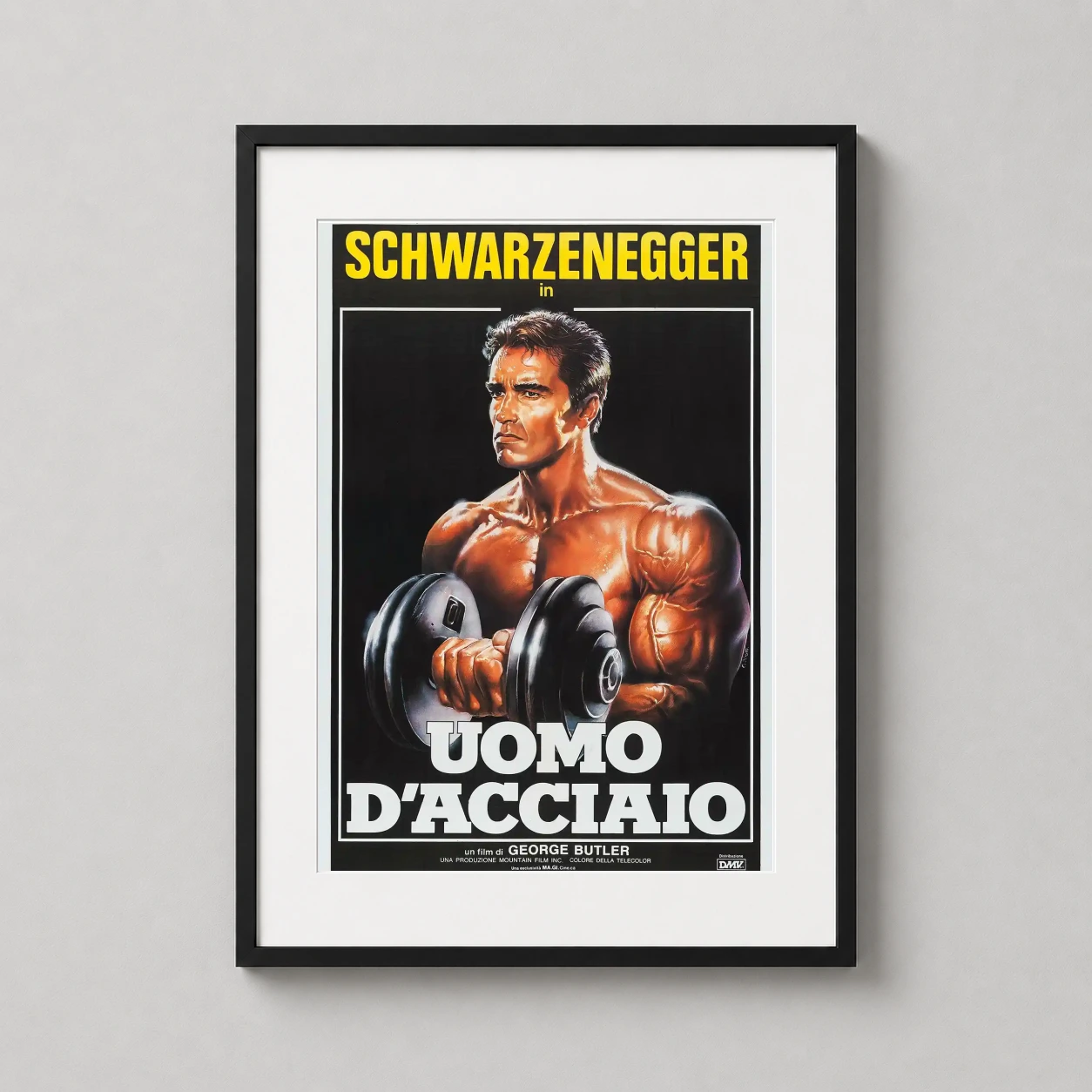 Room mockup of Pumping Iron 1977 Arnold Schwarzenegger Italian Movie Poster, displayed as framed wall art in a home theater setting as a portrait print with yellow and gold tones.