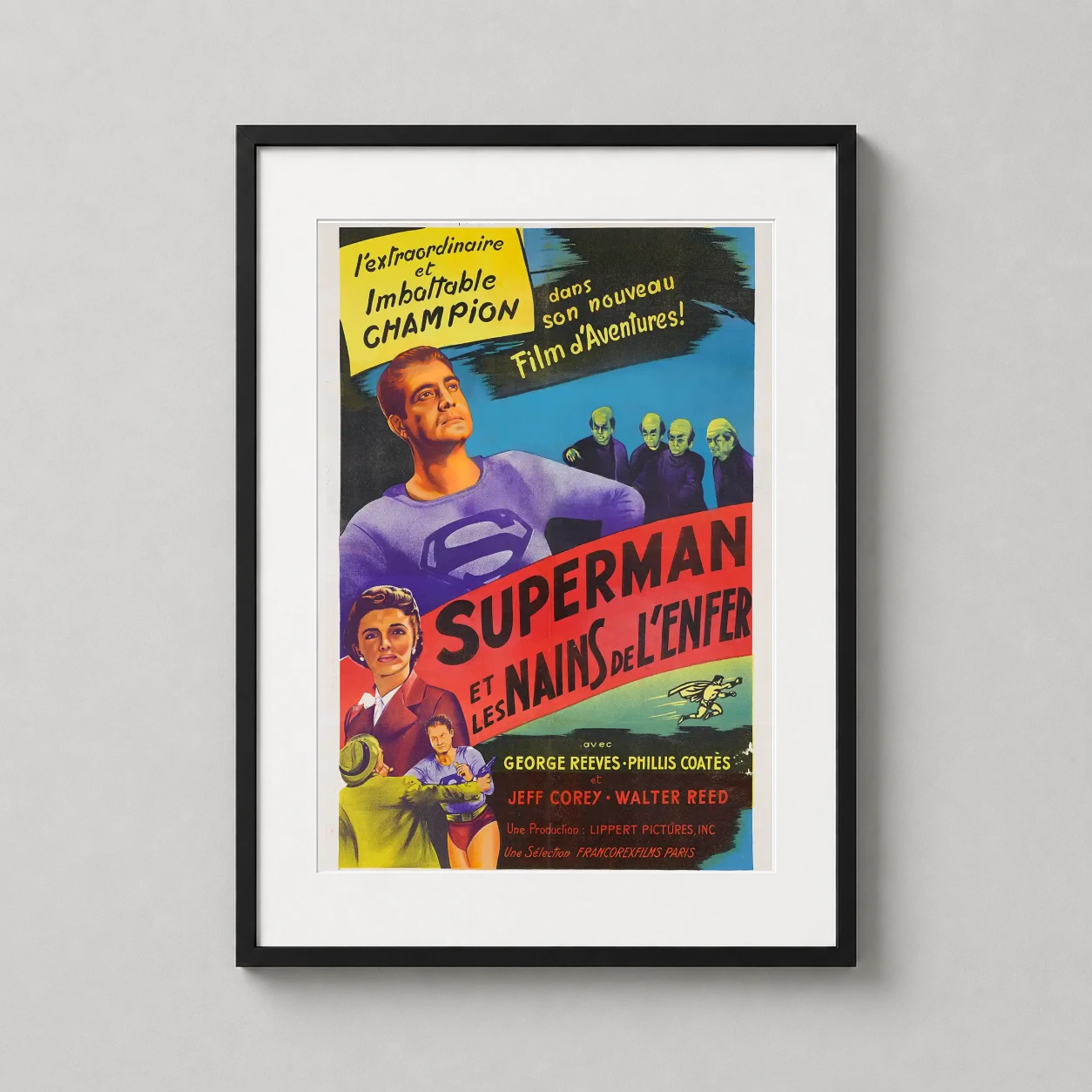 Room mockup of Superman and the Mole Men 1951 French Vintage Movie Poster, displayed as framed wall art in a home theater setting as a portrait print with blue tones.