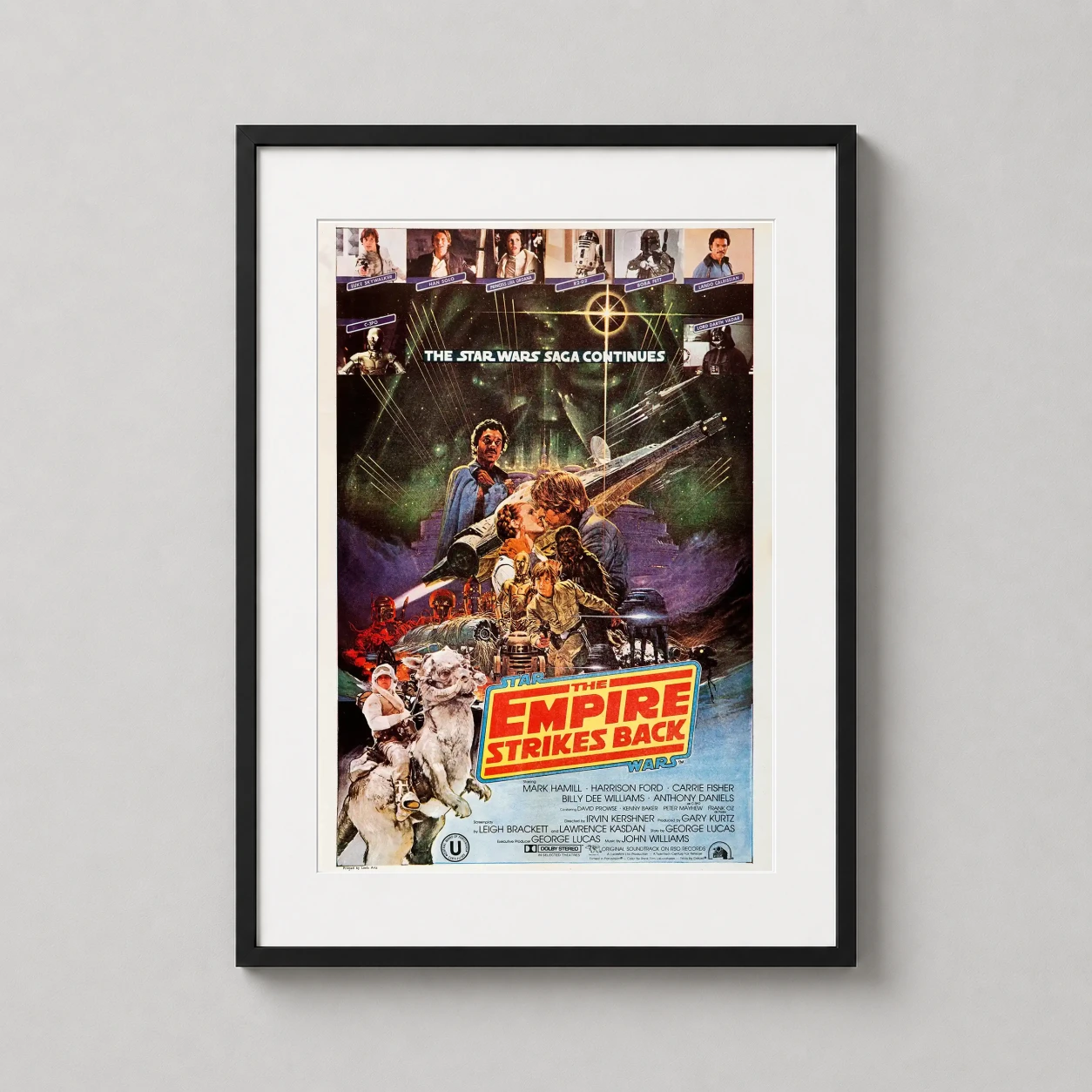 Empire Strikes Back 1980 — this illustrated poster features Luke Skywalker on a Tauntaun, Darth