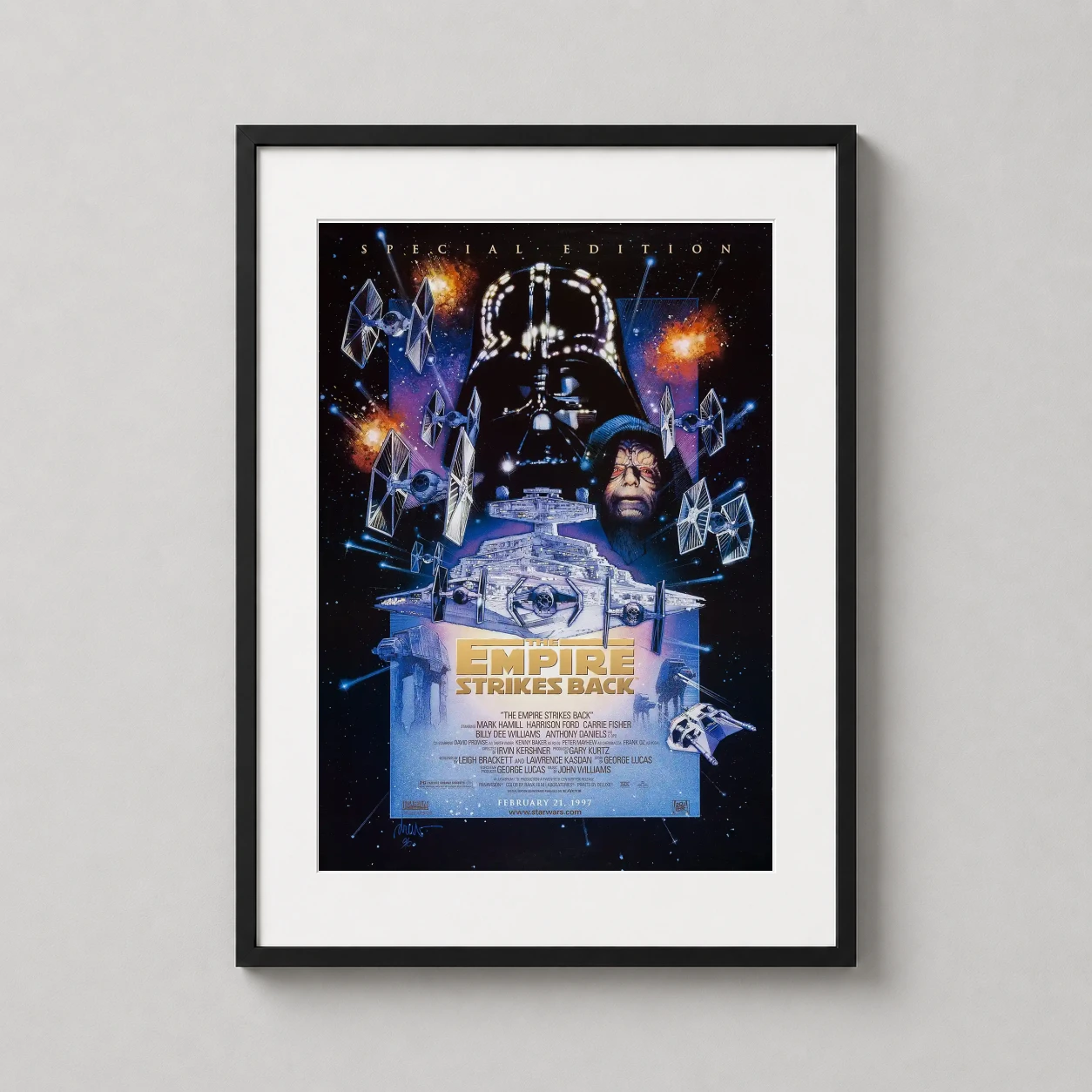 Room mockup of Empire Strikes Back 1980 Special Edition Movie Poster, displayed as framed wall art in a home theater setting as a portrait print with blue, orange, and black tones.
