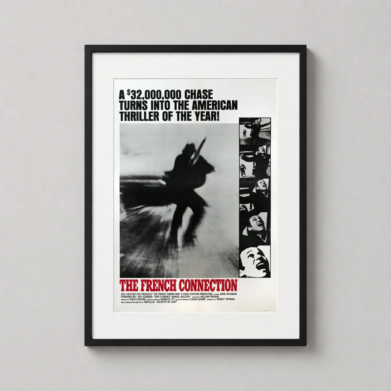 Room mockup of The French Connection 1971 Vintage Crime Movie Poster, displayed as framed wall art in a home theater setting as a portrait print with black and white and red tones.