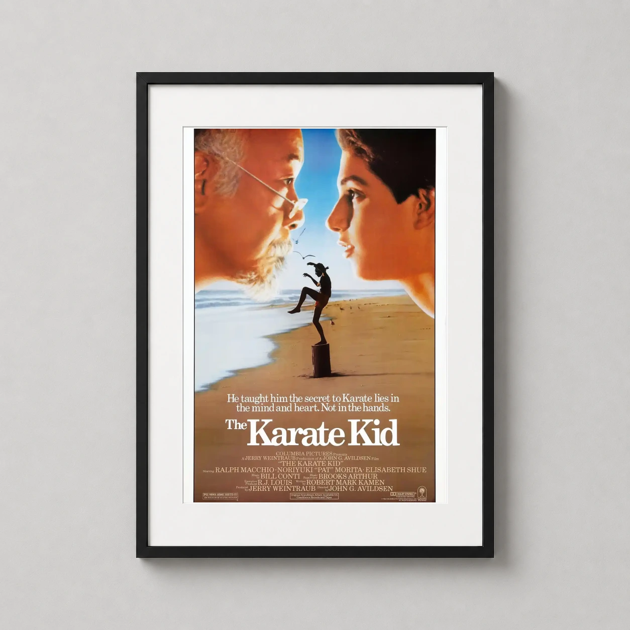 Karate Kid — vintage 1984 movie poster featuring the profiles of Mr. Miyagi and