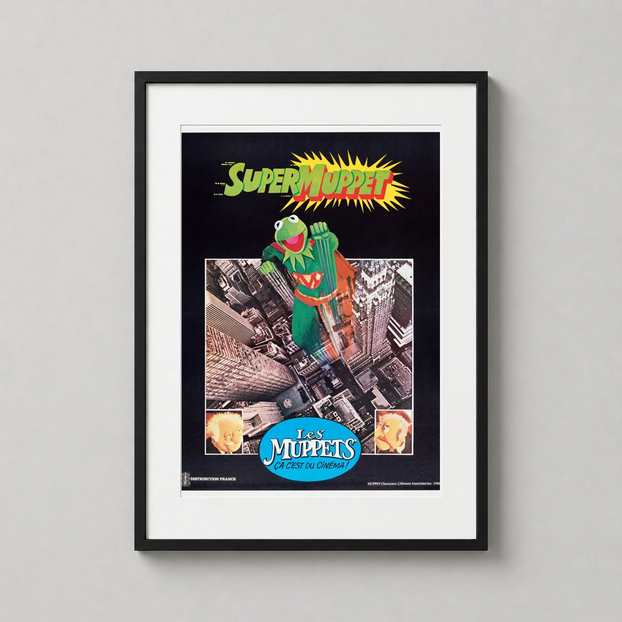 Room mockup of SuperMuppet Kermit the Frog French Movie Vintage Movie Poster, displayed as framed wall art in a home theater setting as a portrait print with red tones.