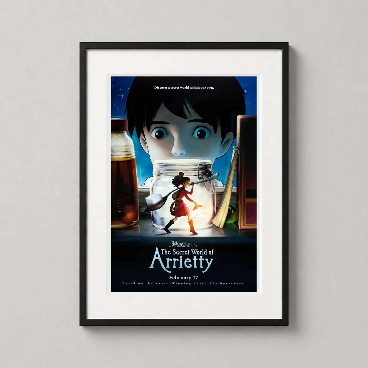 Secret World of Arrietty — studio Ghibli poster featuring Arrietty carrying a sugar cube past a