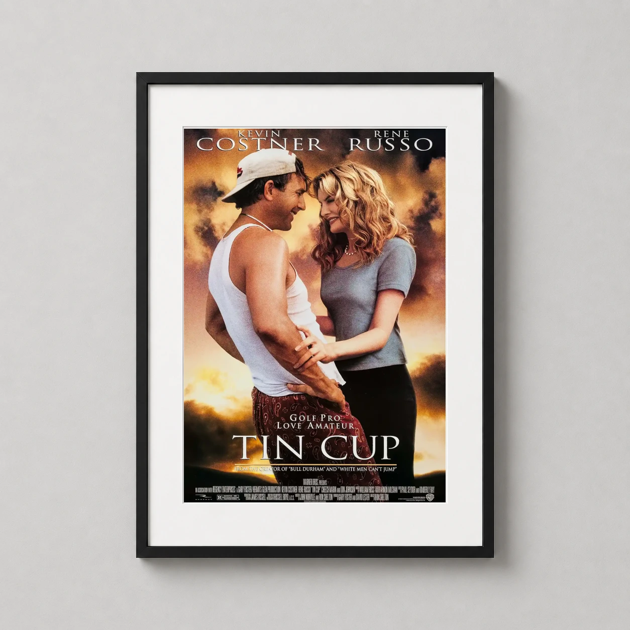 Tin Cup — featuring Kevin Costner and Rene Russo against a sunset backdrop, this