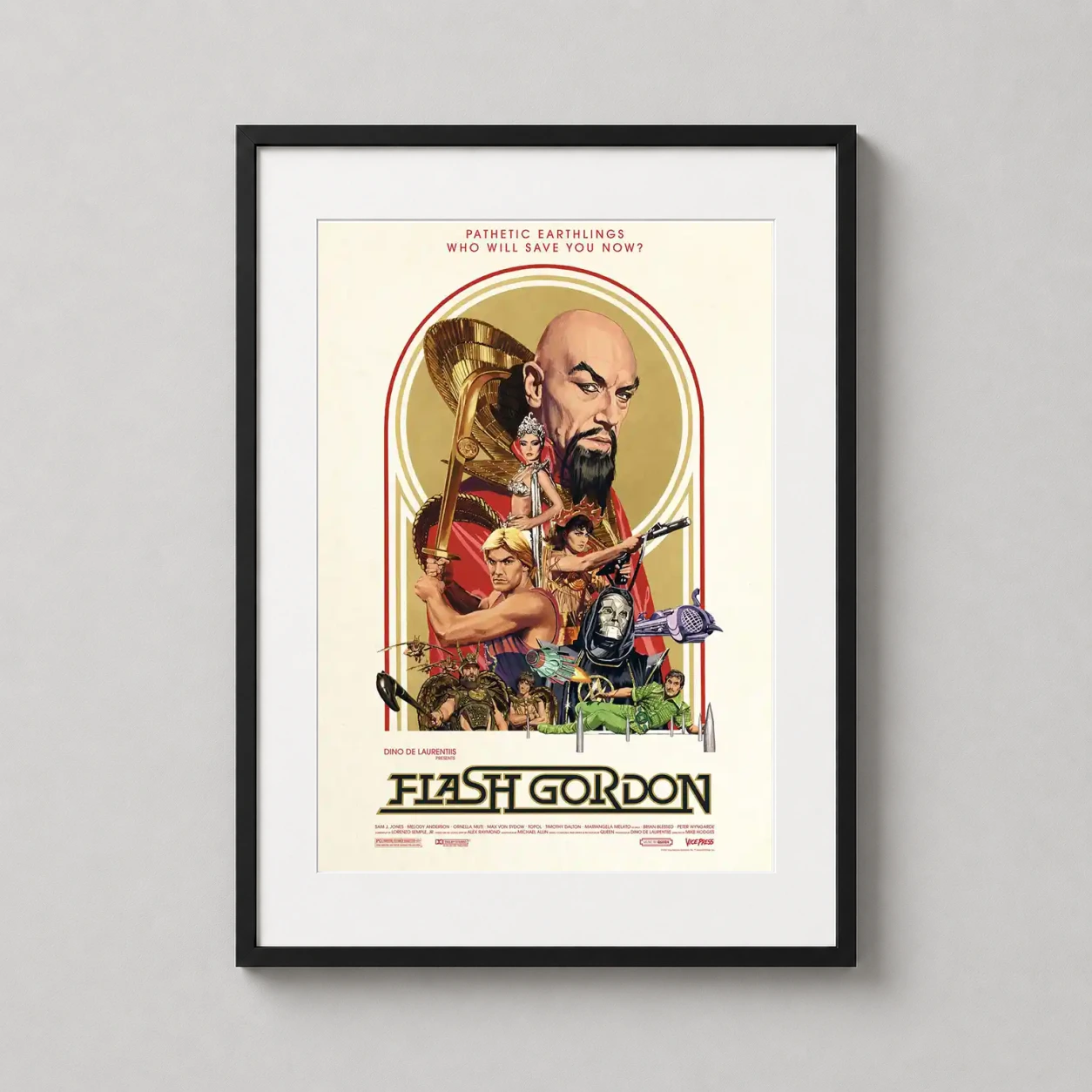 Room mockup of Flash Gordon 1980 Retro Sci-Fi Art Deco Print Movie Poster, displayed as framed wall art in a home theater setting as a portrait print with gold tones.