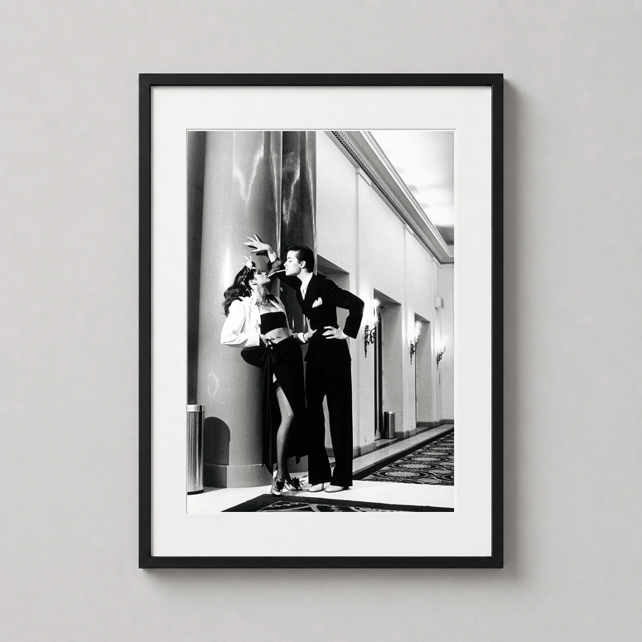 Helmut Newton Woman Into — stark black and white photograph by Helmut Newton featuring two models