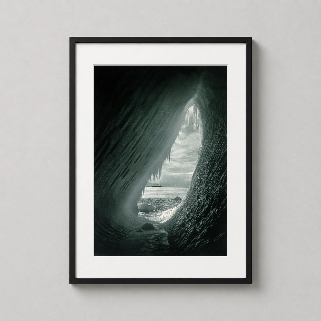 Herbert Ponting Cavern Iceberg Photo — dramatic monochrome photograph by Herbert Ponting showing the Terra