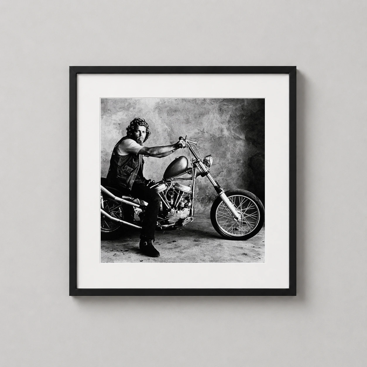 Irving Penn Hells Angel — monochromatic Irving Penn portrait of Hells Angel Doug seated on a