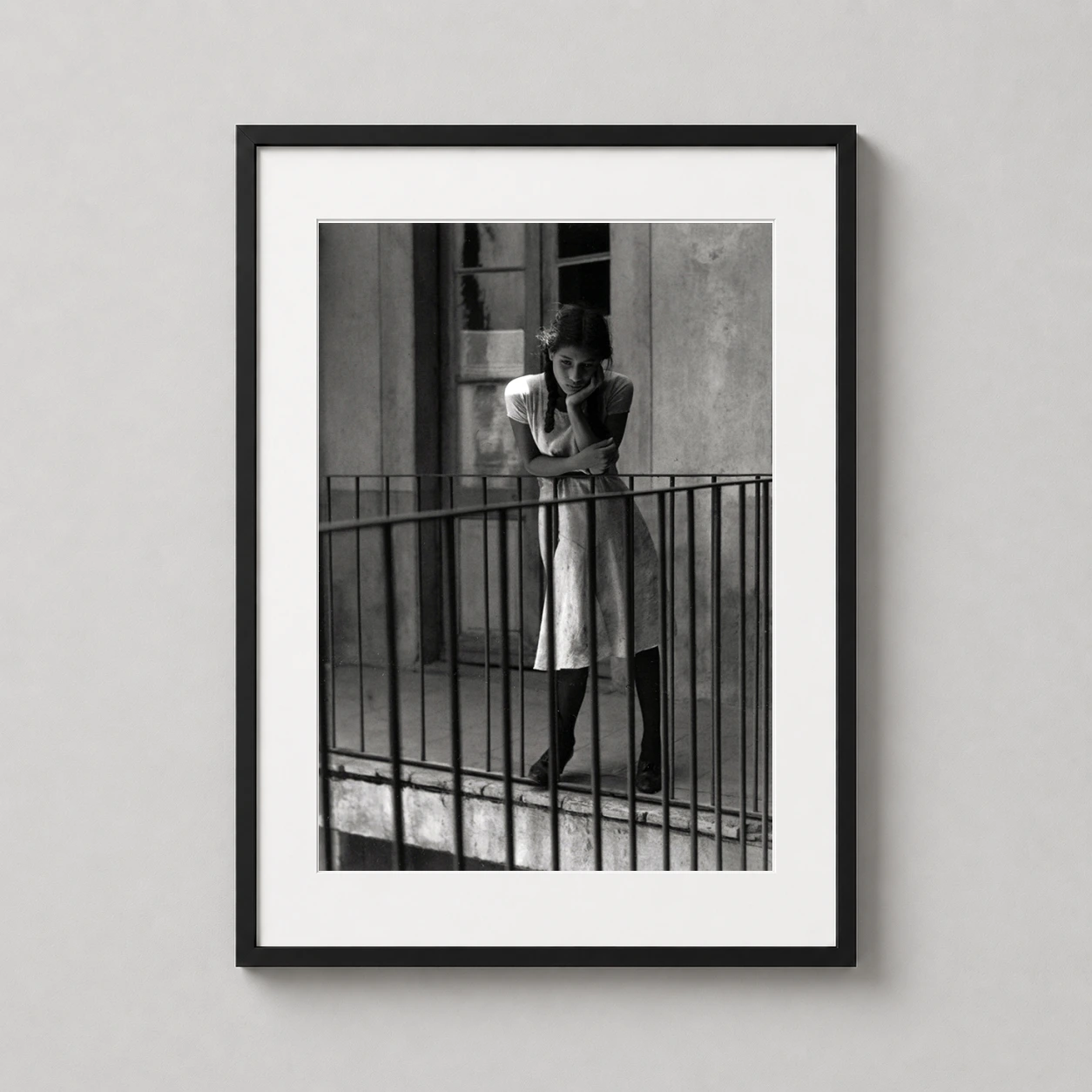 Ensueno Manuel Alvarez Bravo — black and white photograph of a young girl on a balcony, capturing a
