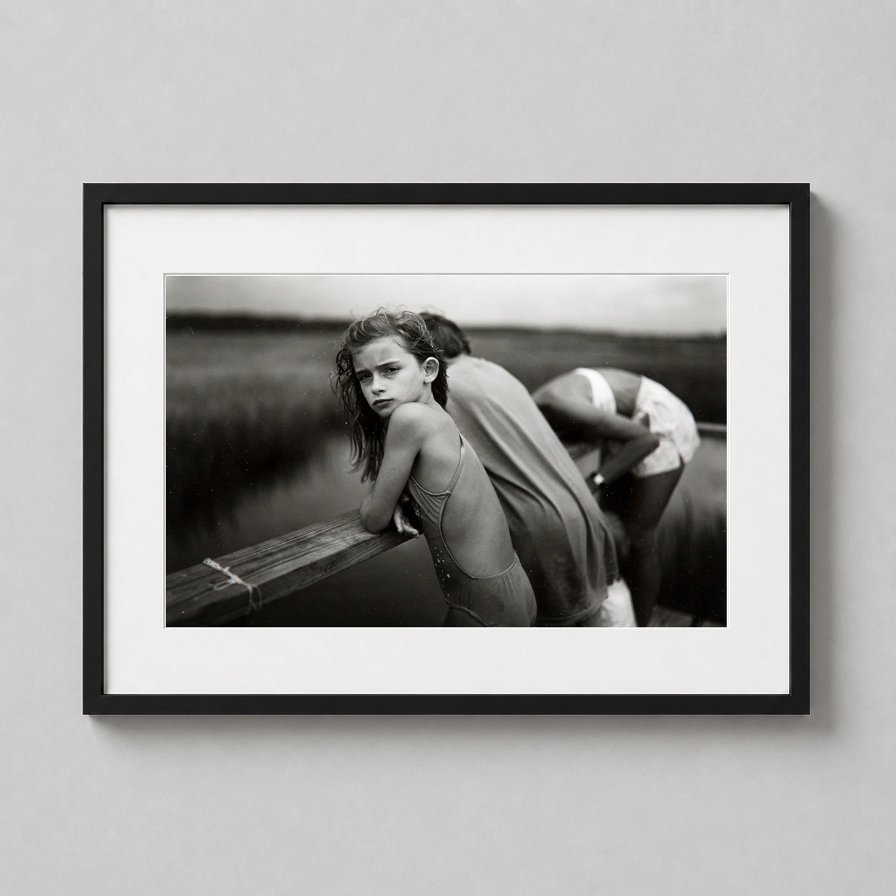 Sally Mann Jessie Wind — black and white fine art photograph capturing a young girl leaning