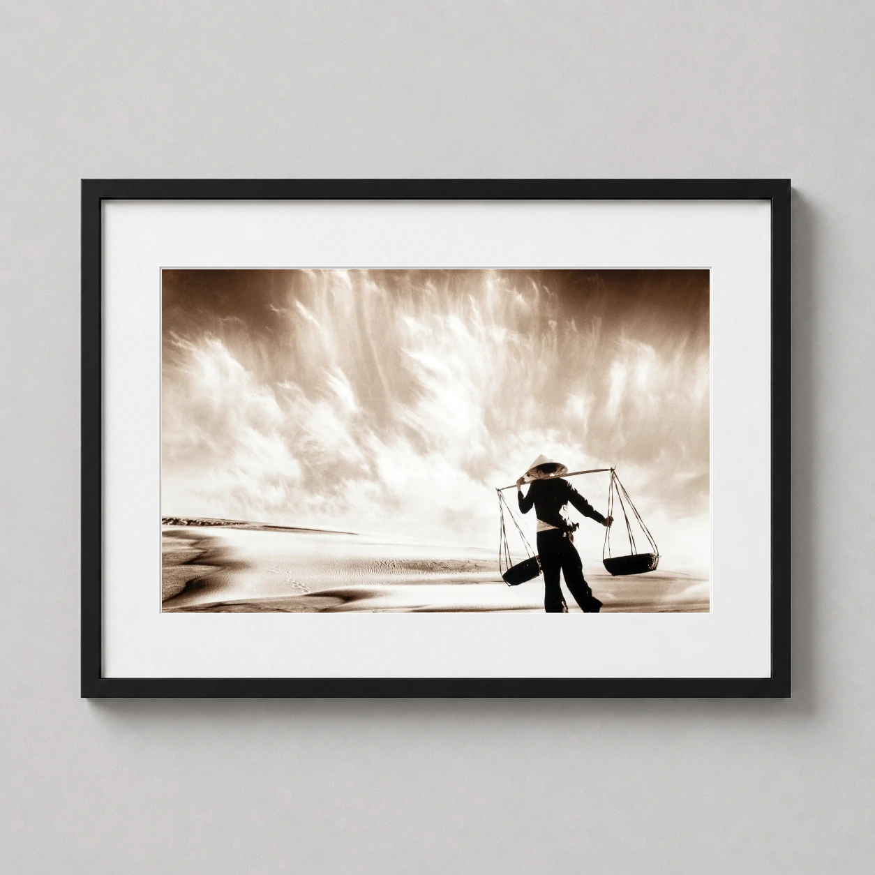 Don Hong Oai Sand Photo — this sepia-toned art print features a silhouetted figure carrying