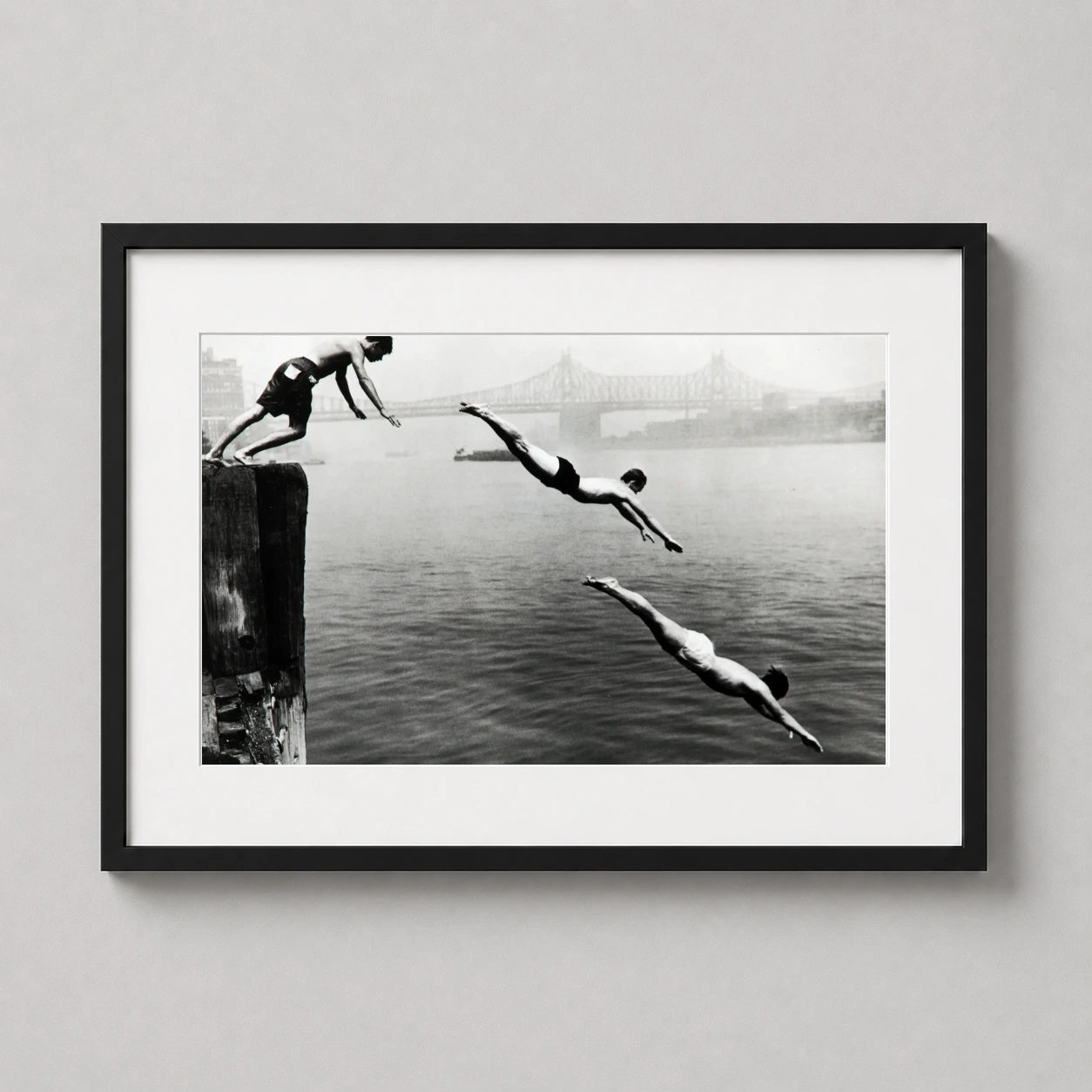 Arthur Leipzig Divers East — black and white photograph by Arthur Leipzig capturing three men diving