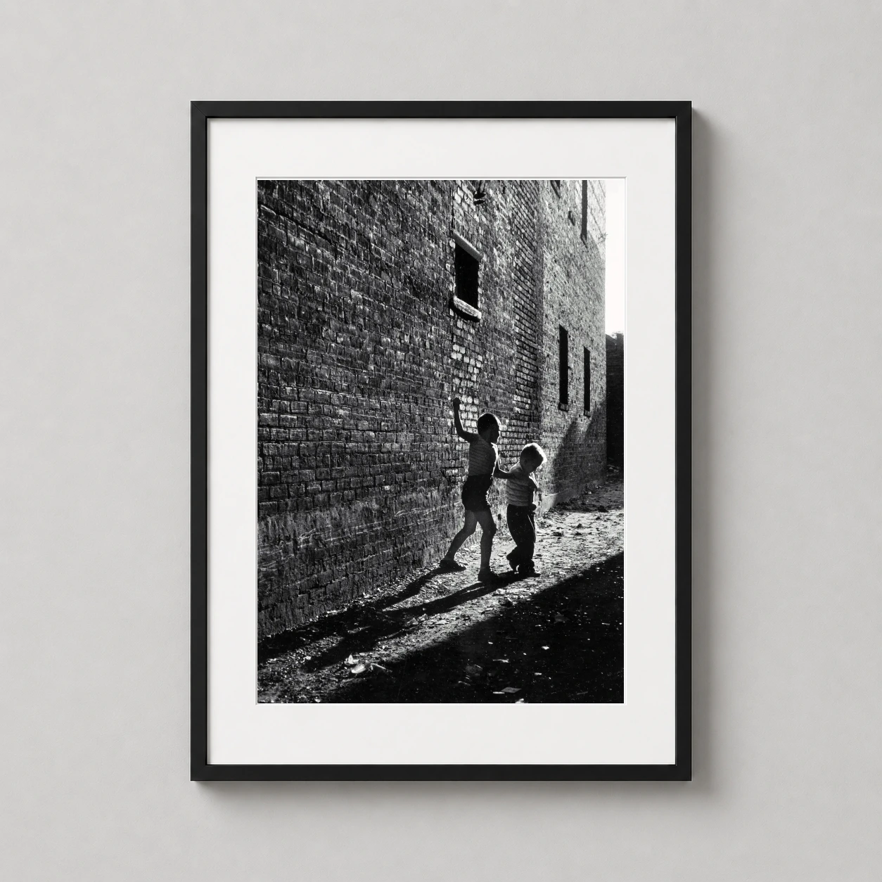 Dave Heath — dramatic black and white photograph from 1956 showing two children