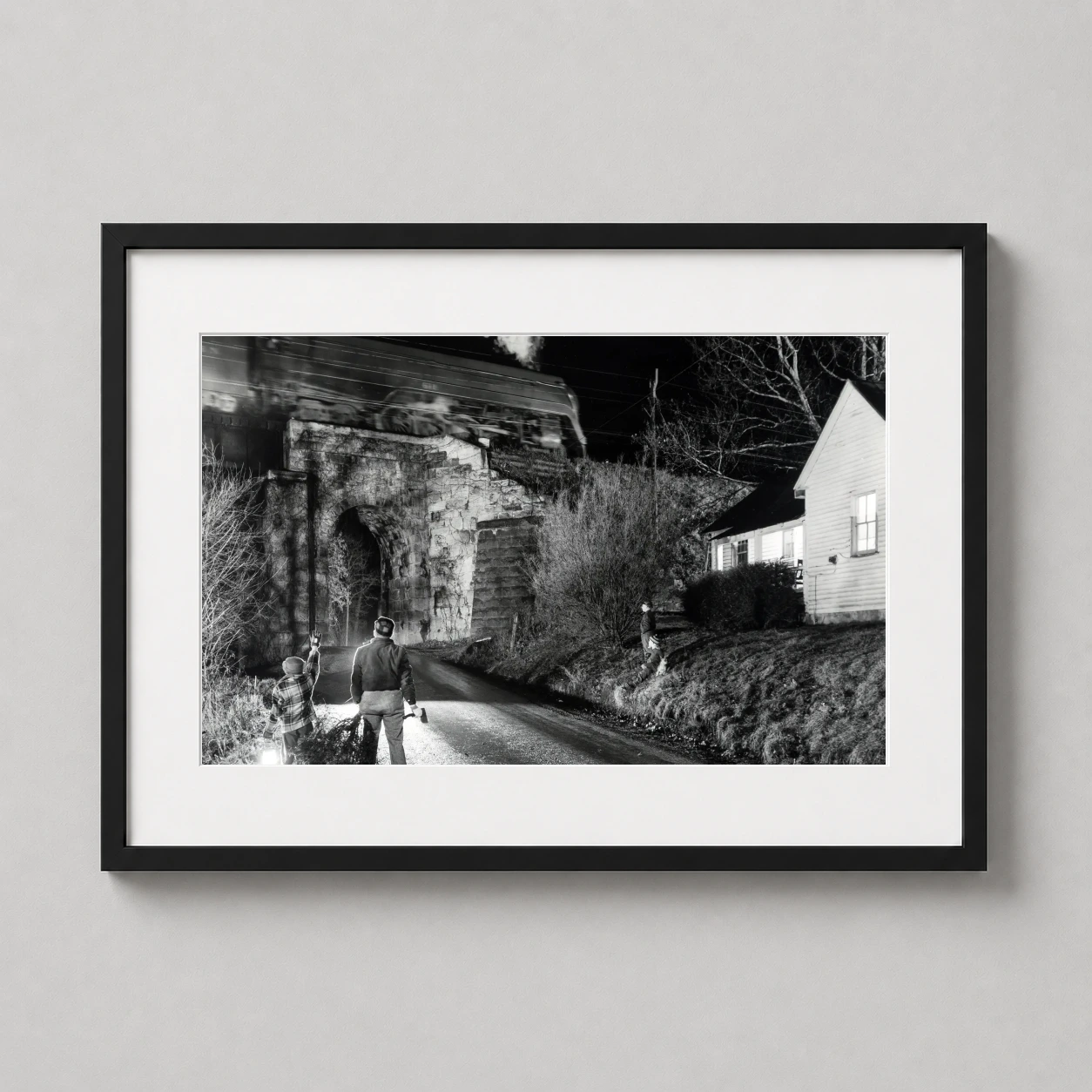 Christmas Time Seven Mile O Winston Link — dramatic black and white photograph of a steam train crossing a stone