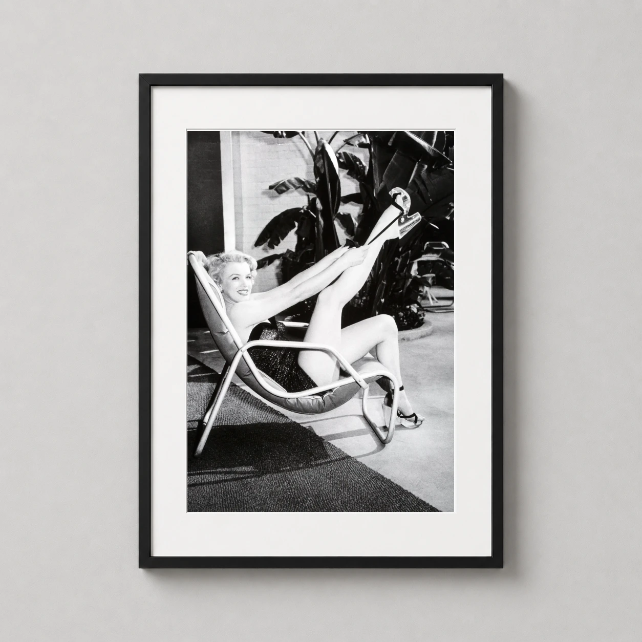 Marilyn Monroe Lounging Patio — black and white Frank Worth photograph of Marilyn Monroe in a patio