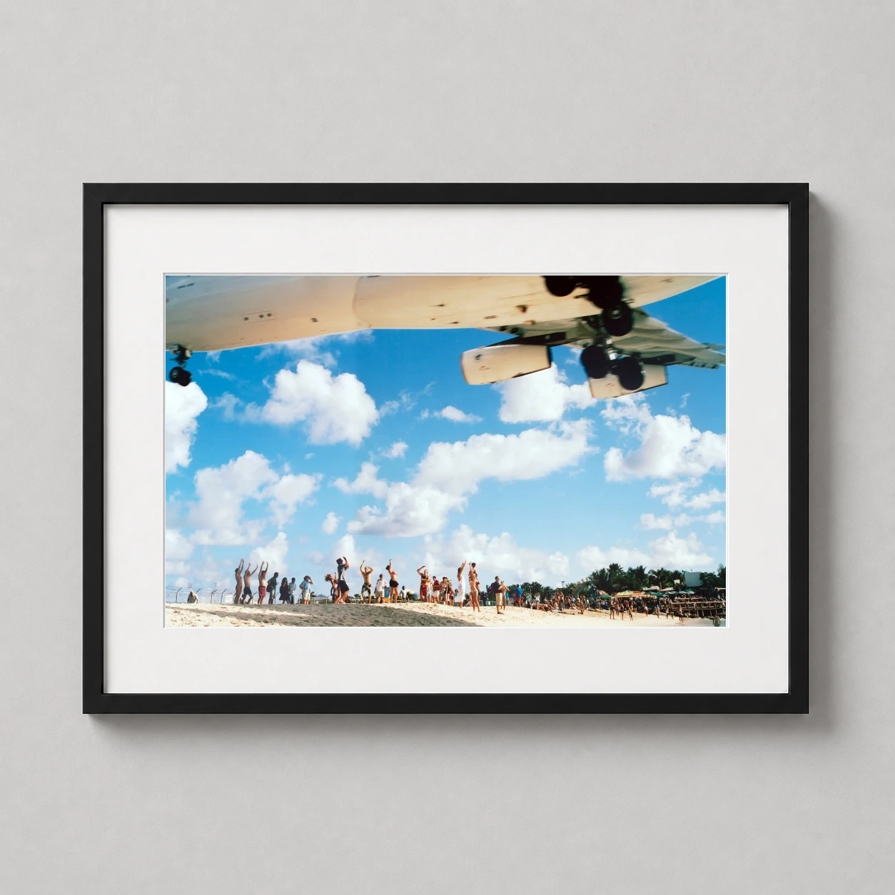 Kevin Cooley Air France — massive Air France jet descends low over a crowd of beachgoers on the