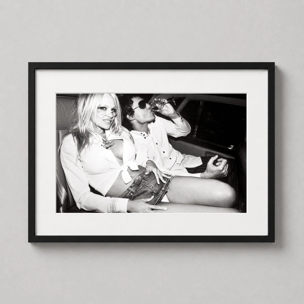 Pamela Anderson — high-contrast black and white photograph of Pamela Anderson and David