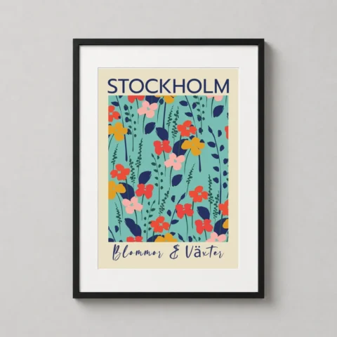 Stockholm floral wall art in a wooden frame hanging on a clean white wall in a sunlit Scandinavian-style living room.