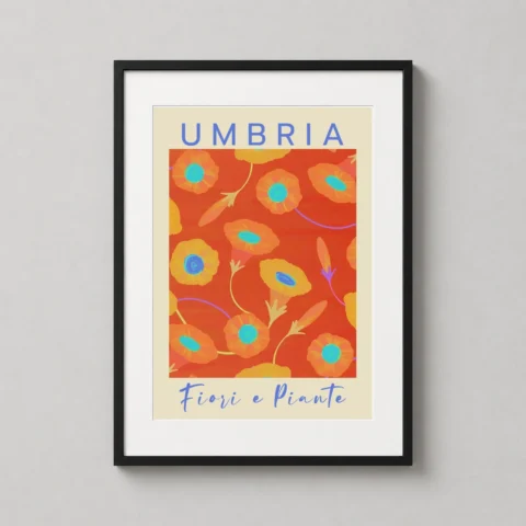 A framed Umbria floral art print with vibrant orange flowers displayed on a neutral wall in a modern living room.