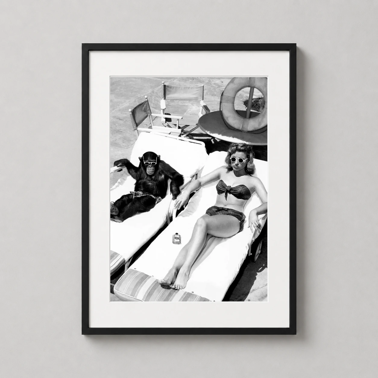 Chimpanzee Woman Sunbathing — humorous vintage black and white photograph featuring a chimpanzee and