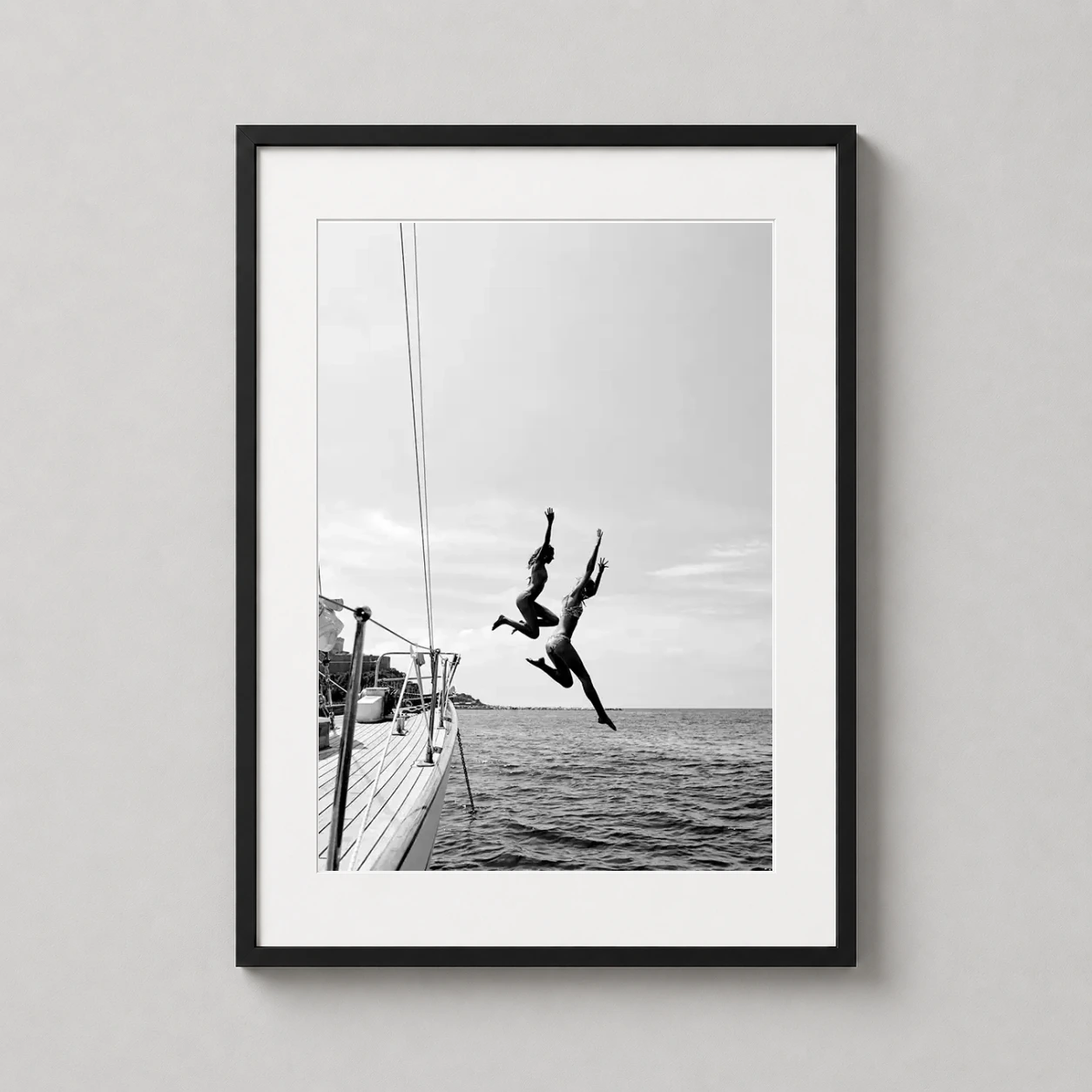 Ocean Jump Sailboat Summer Photo — black and white photography print featuring two women jumping from a