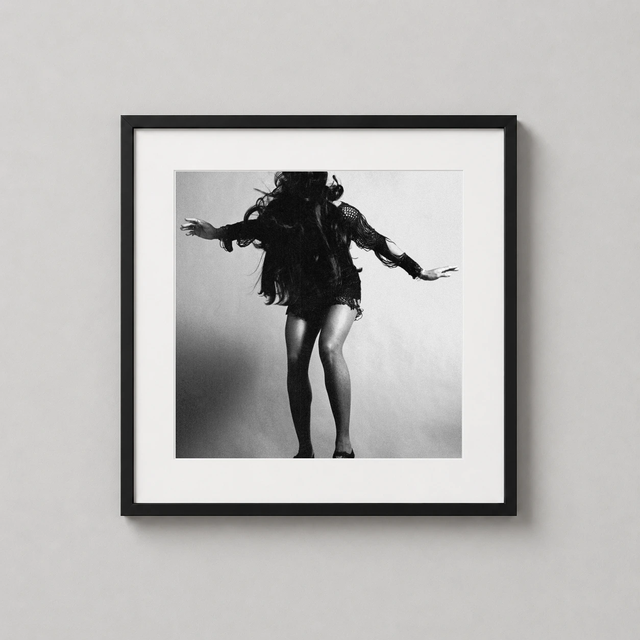 Tina Turner Performance — dynamic black and white photograph of Tina Turner in mid-performance