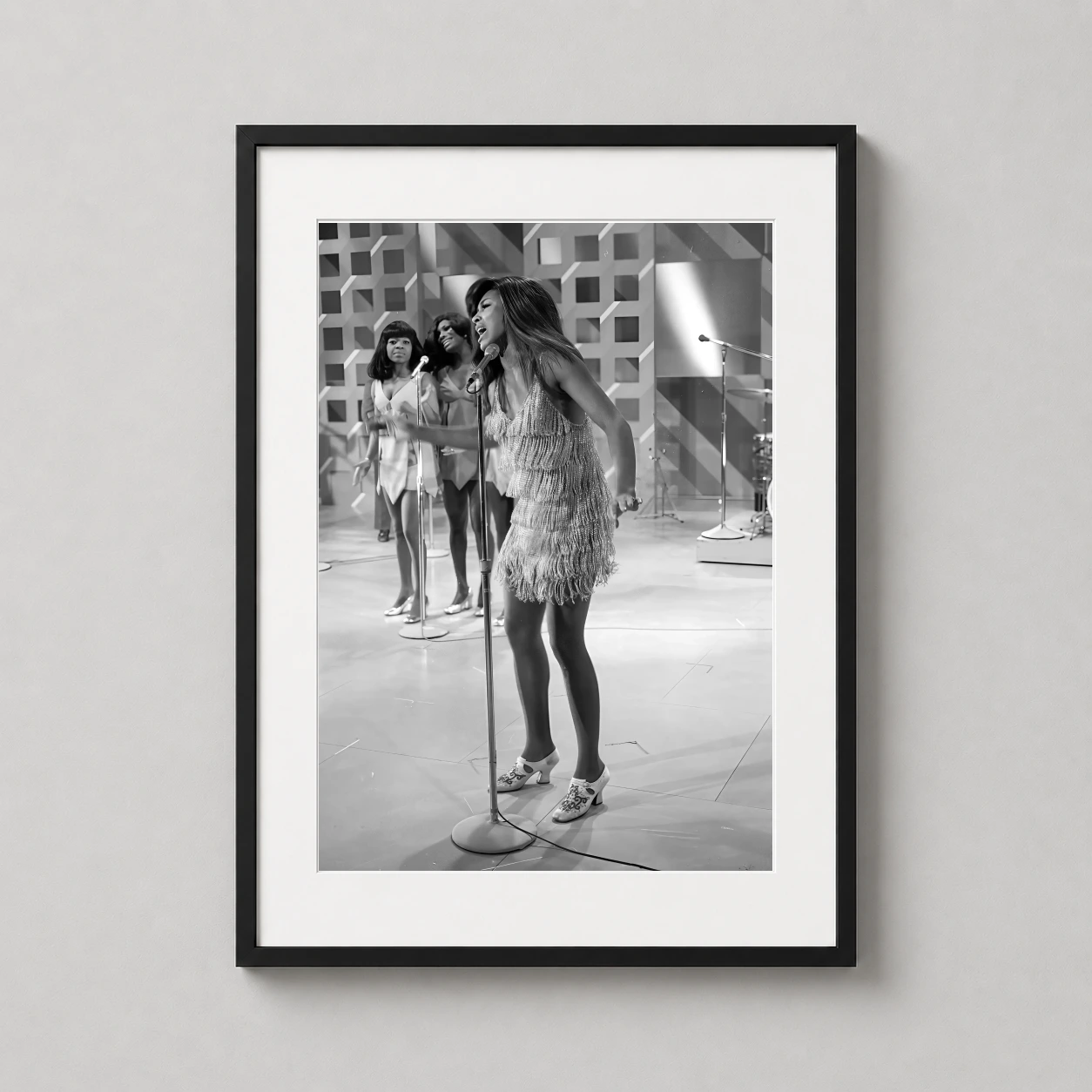 Tina Turner Vintage Performance — powerful black and white photograph of Tina Turner performing in a