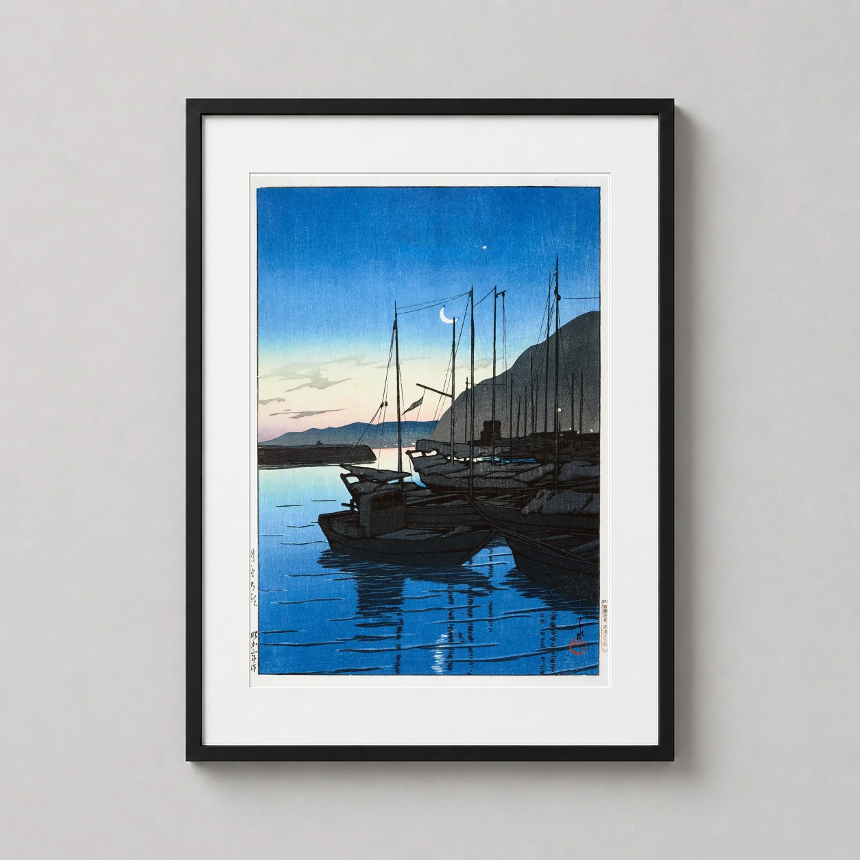 Room mockup of Dawn at Beppu Kawase Hasui Japanese Woodblock Art Print, displayed as framed wall art in a bedroom setting as a portrait print with blue and teal tones.