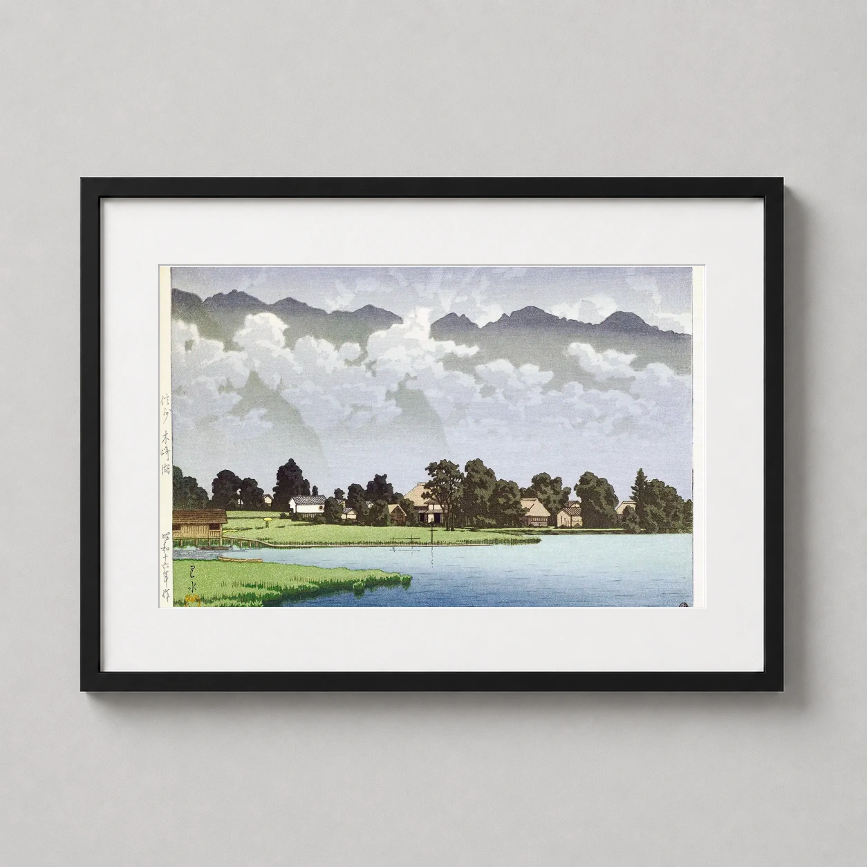 Room mockup of Lake Kizaki in Shinshu 1941, Kawase Hasui Japanese Art Print, displayed as framed wall art in a bedroom setting as a landscape print with blue, green, and white tones.