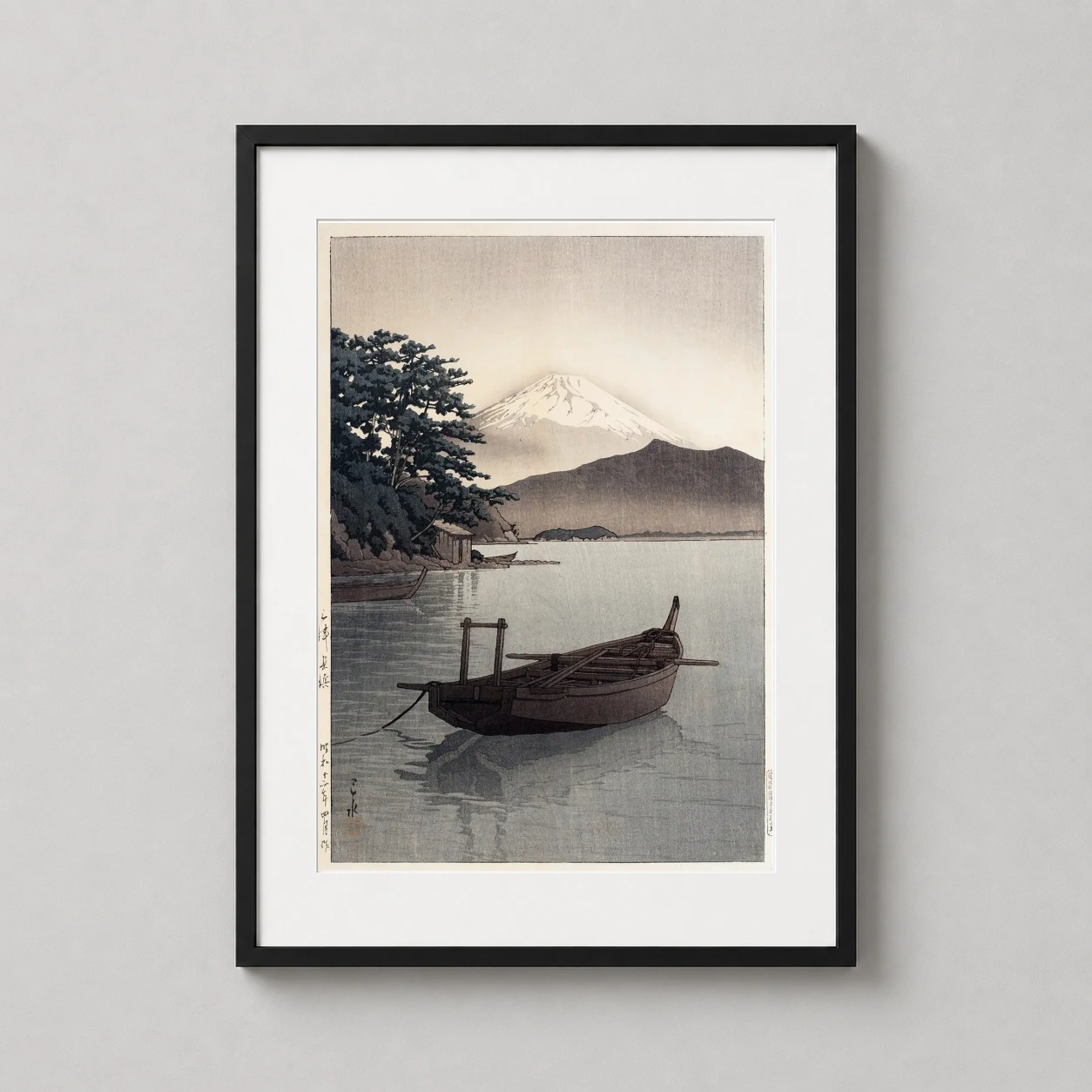 Room mockup of Mito, Nagahama, 1937, Mt. Fuji Japanese Woodblock Art Print, displayed as framed wall art in a bedroom setting as a portrait print with blue tones.