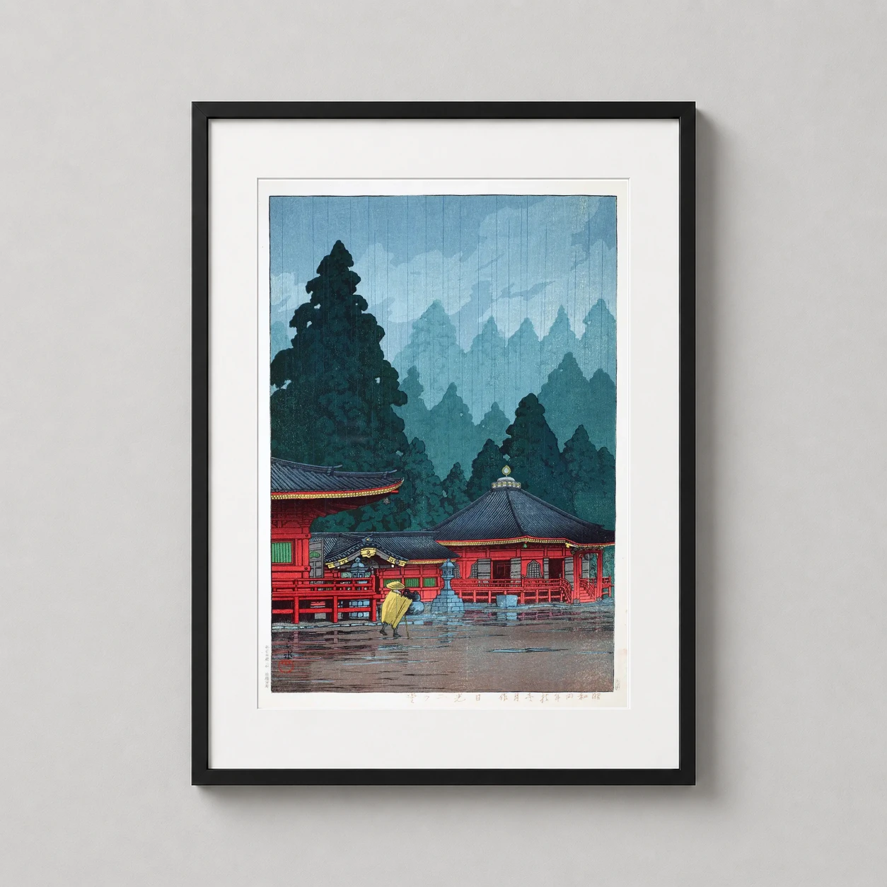 Room mockup of Kawase Hasui Nikko Futatsudo Hall Japanese Woodblock Art Print, displayed as framed wall art in a bedroom setting as a portrait print with green and red tones.