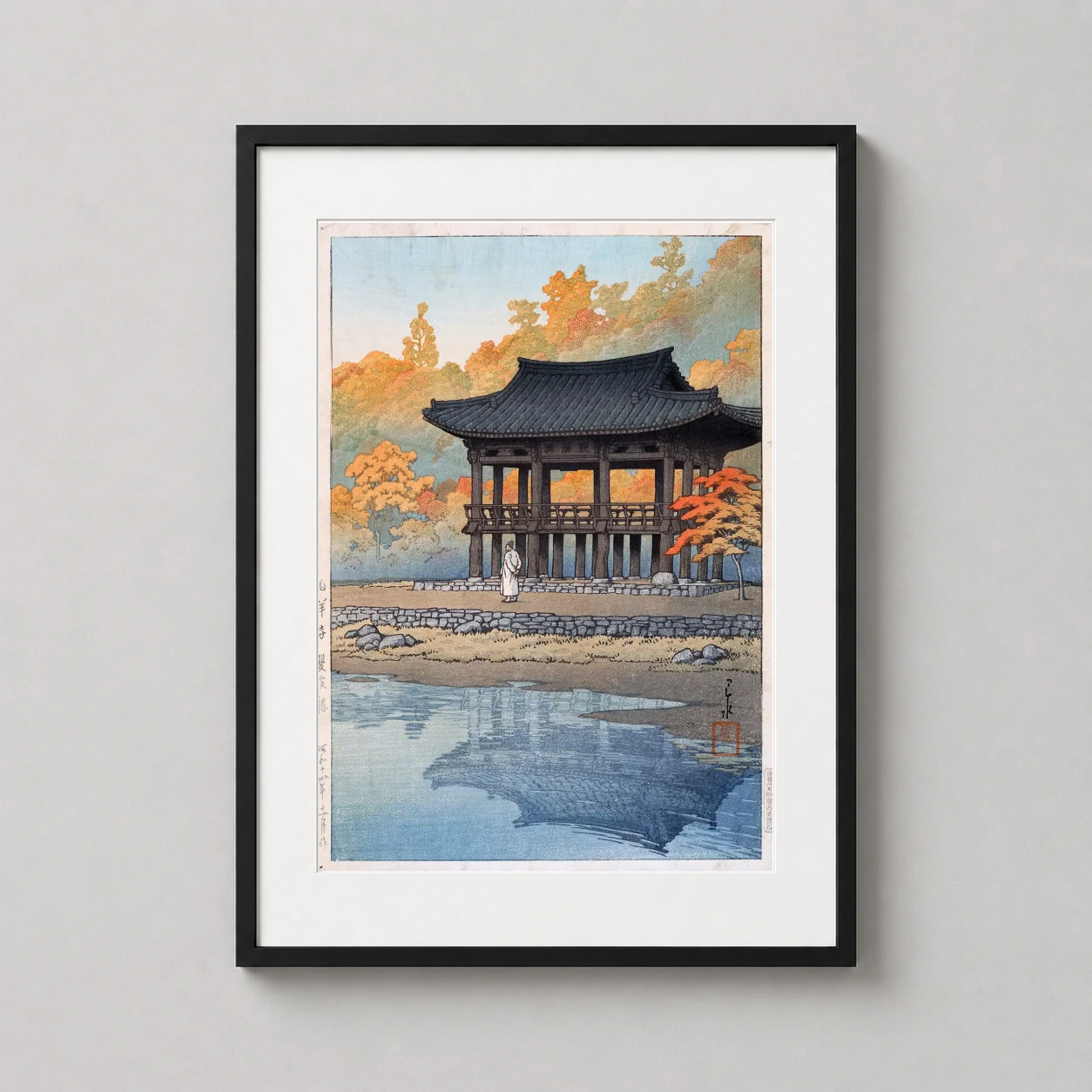 Room mockup of Sanggye Pavilion Paekyang Temple, Kawase Hasui Art Print, displayed as framed wall art in a bedroom setting as a portrait print with yellow tones.