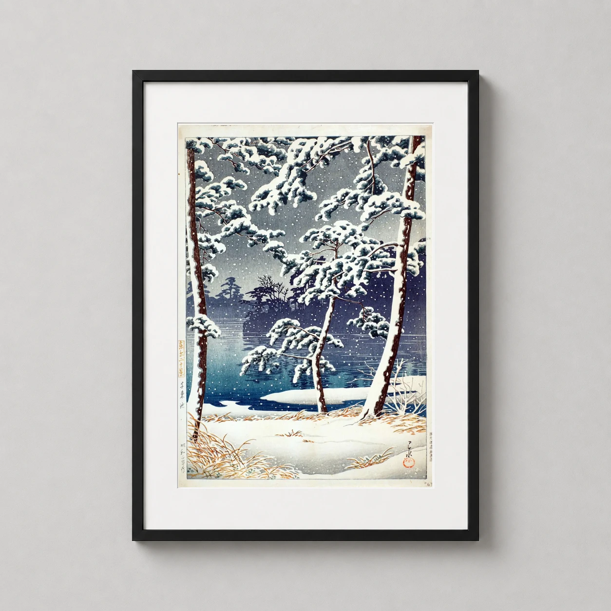 Room mockup of Senzoku Pond at Sunset in Snow, Japanese Woodblock Art Print, displayed as framed wall art in a bedroom setting as a portrait print with blue and teal tones.