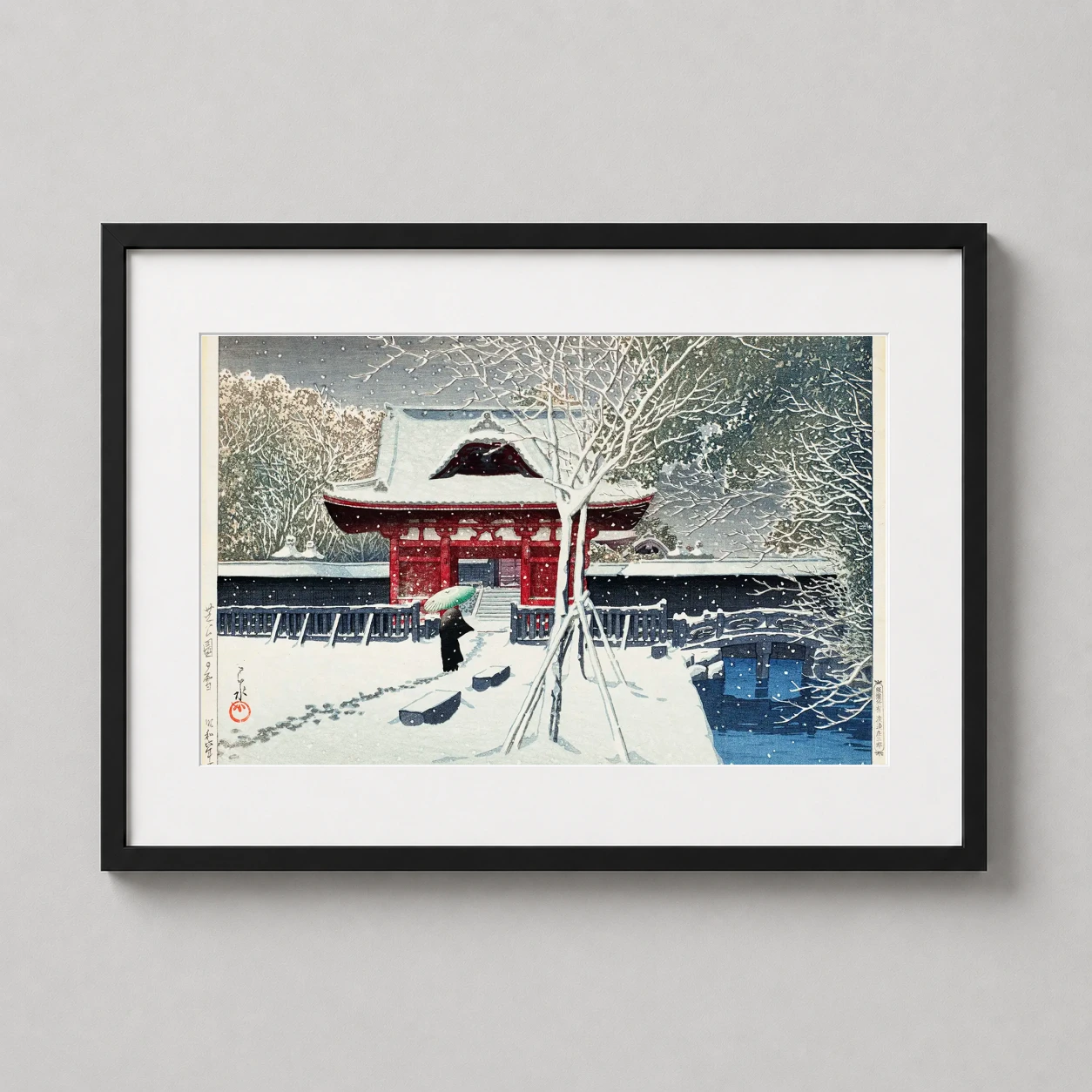 Room mockup of Snow at Shiba Park Tokyo, Kawase Hasui Japanese Art Print, displayed as framed wall art in a bedroom setting as a landscape print with red tones.