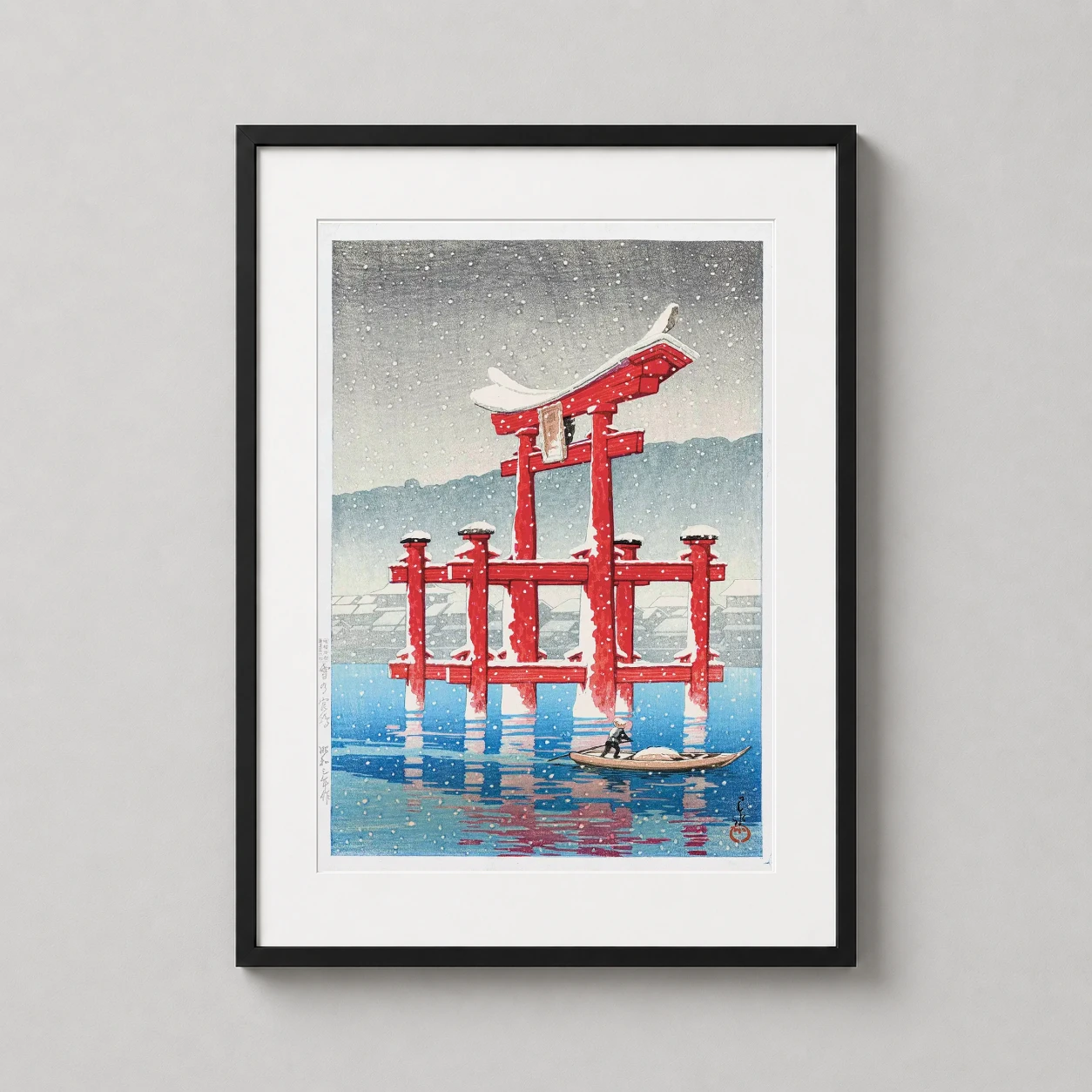Room mockup of Snow at Miyajima Kawase Hasui Japanese Woodblock Art Print, displayed as framed wall art in a bedroom setting as a portrait print with blue and red tones.
