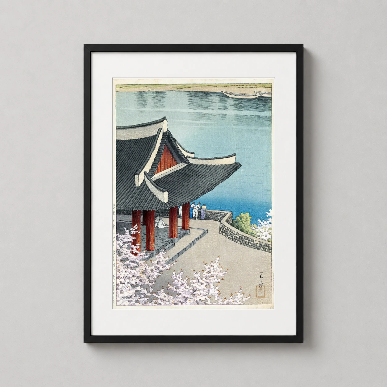 Room mockup of Pubyong Pavilion Pyongyang Spring Japanese Woodblock Art Print, displayed as framed wall art in a bedroom setting as a portrait print with red and pink tones.