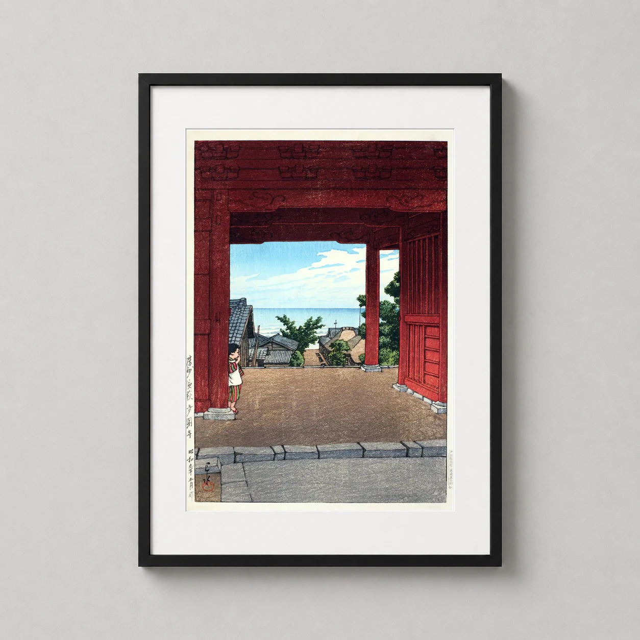 Tamon Temple Hamahagi Awa — vibrant red temple gate frames a peaceful view of a coastal Japanese