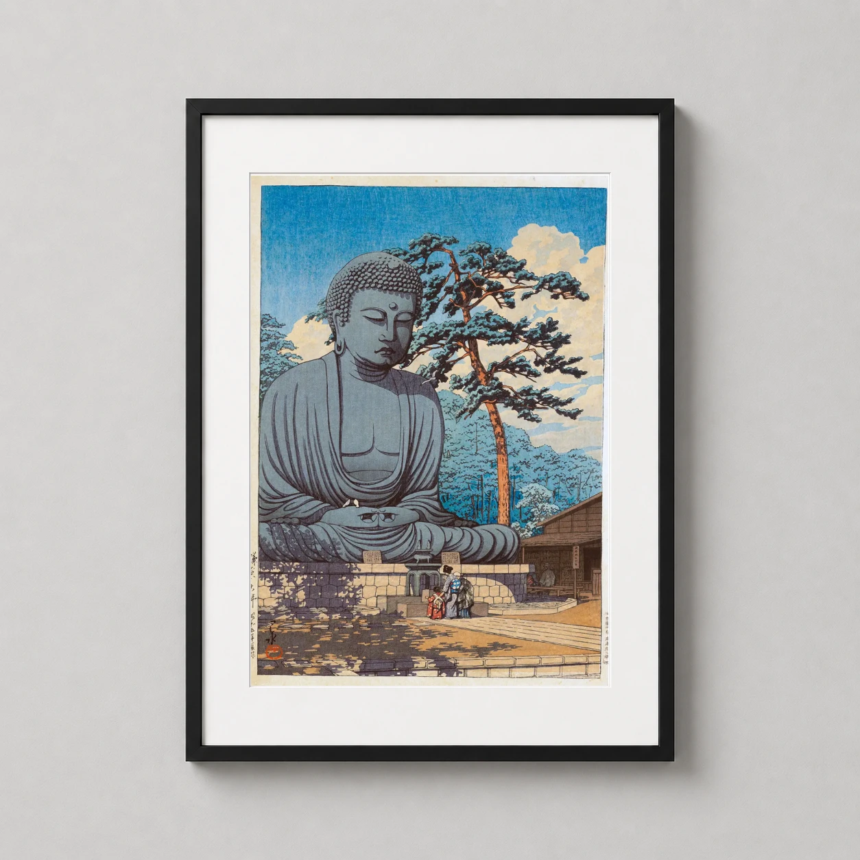 Room mockup of The Great Buddha at Kamakura Japanese Woodblock Art Print, displayed as framed wall art in a bedroom setting as a portrait print with blue tones.