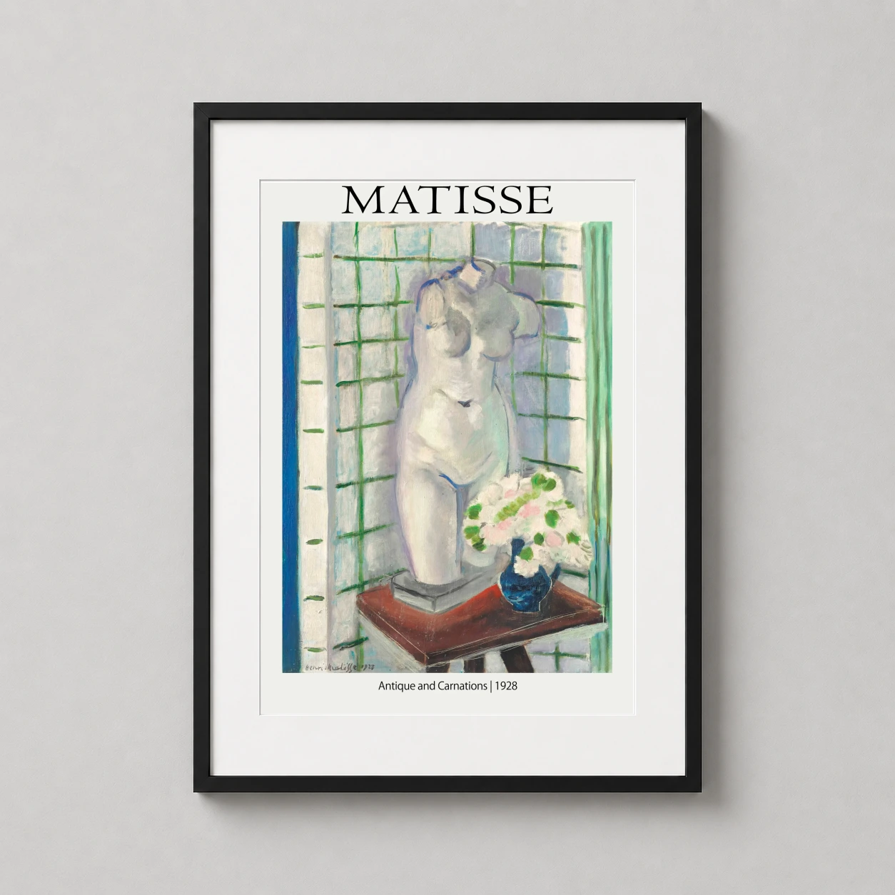 Room mockup of Matisse Antique and Carnations 1928 Exhibition Art Print, displayed as framed wall art in a living room setting as a portrait print with blue, pink, and white tones.