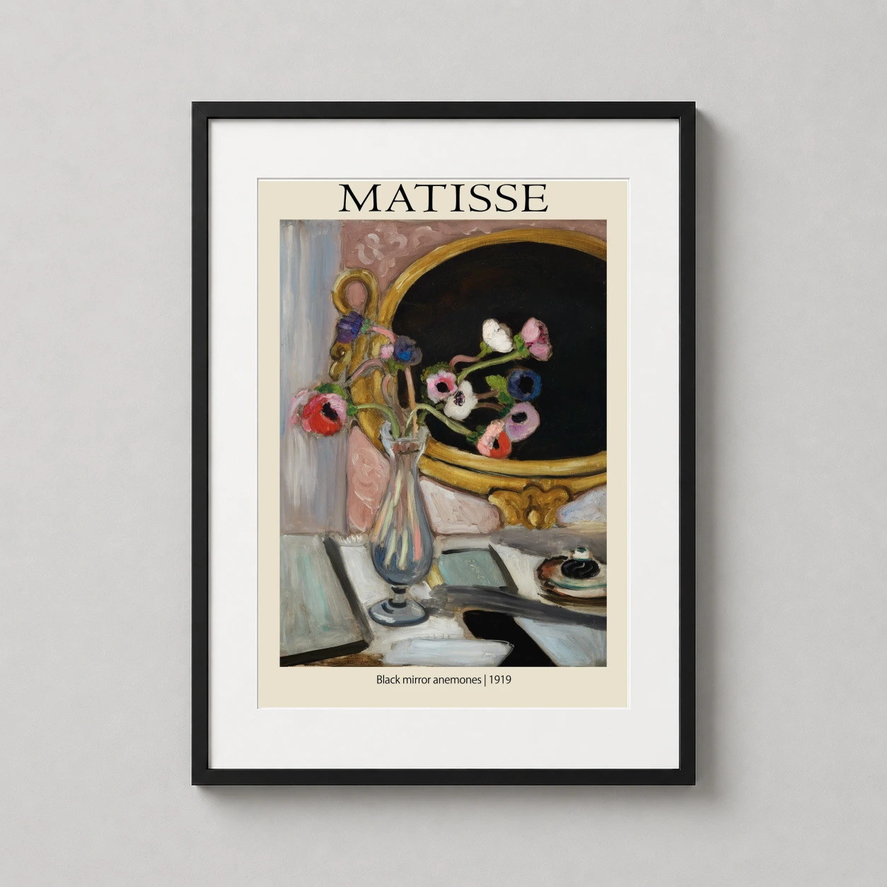 Room mockup of Matisse Black Mirror Anemones 1919 Fine Art Poster, displayed as framed wall art in a living room setting as a portrait print with gold, pink, and black tones.