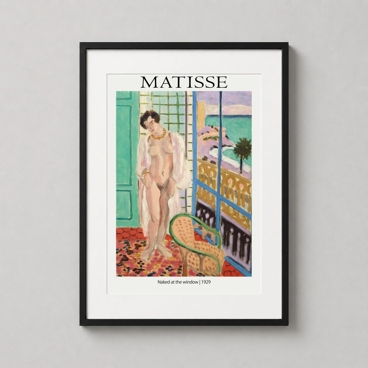 Room mockup of Henri Matisse Naked at the Window 1929 French Modern Art Print, displayed as framed wall art in a living room setting as a portrait print with gold tones.
