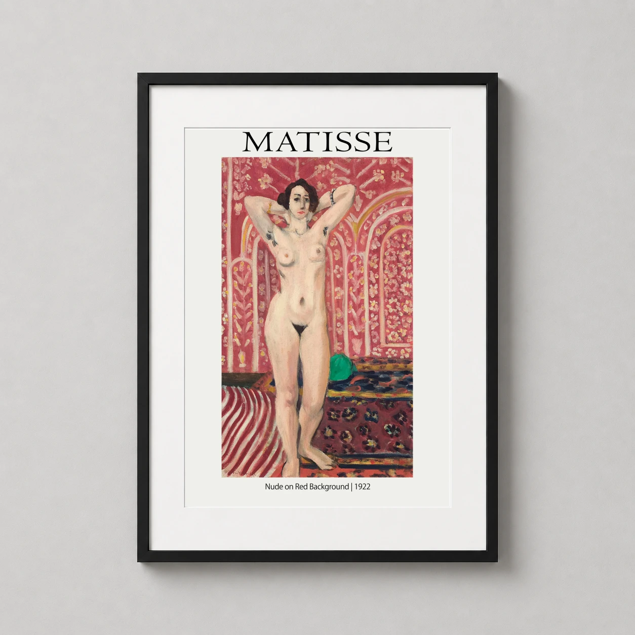 Room mockup of Matisse Nude on Red Background 1922 Exhibition Art Print, displayed as framed wall art in a bedroom setting as a portrait print with red and pink tones.