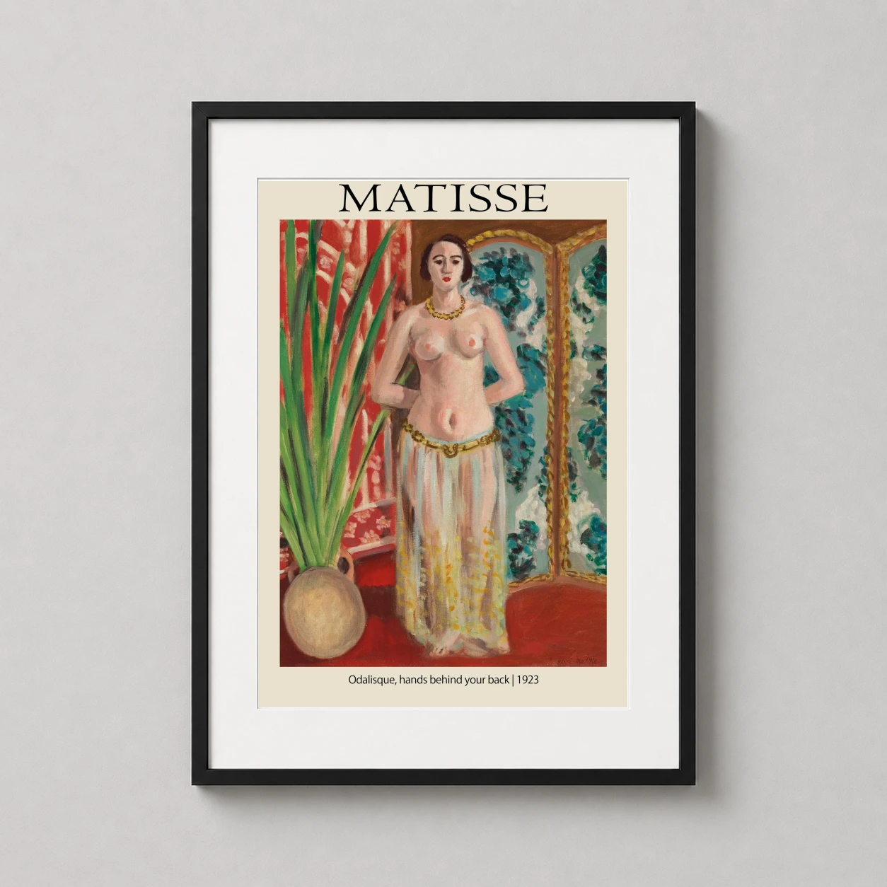 Room mockup of Matisse Odalisque Hands Behind Your Back 1923 Art Print, displayed as framed wall art in a living room setting as a portrait print with green and red tones.
