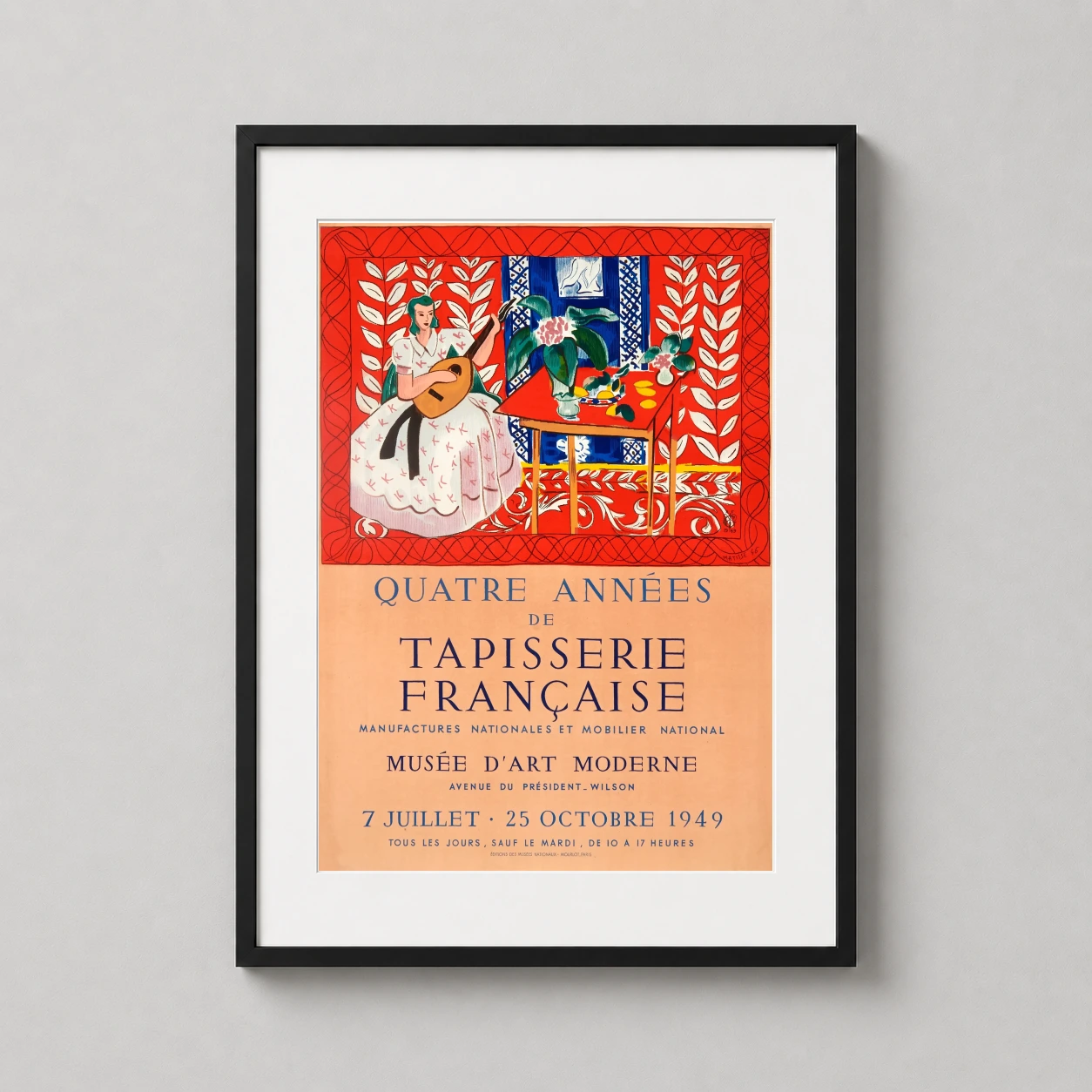 Room mockup of Matisse Quatre Années de Tapisserie Française 1949 Art Print, displayed as framed wall art in a living room setting as a portrait print with blue and red tones.