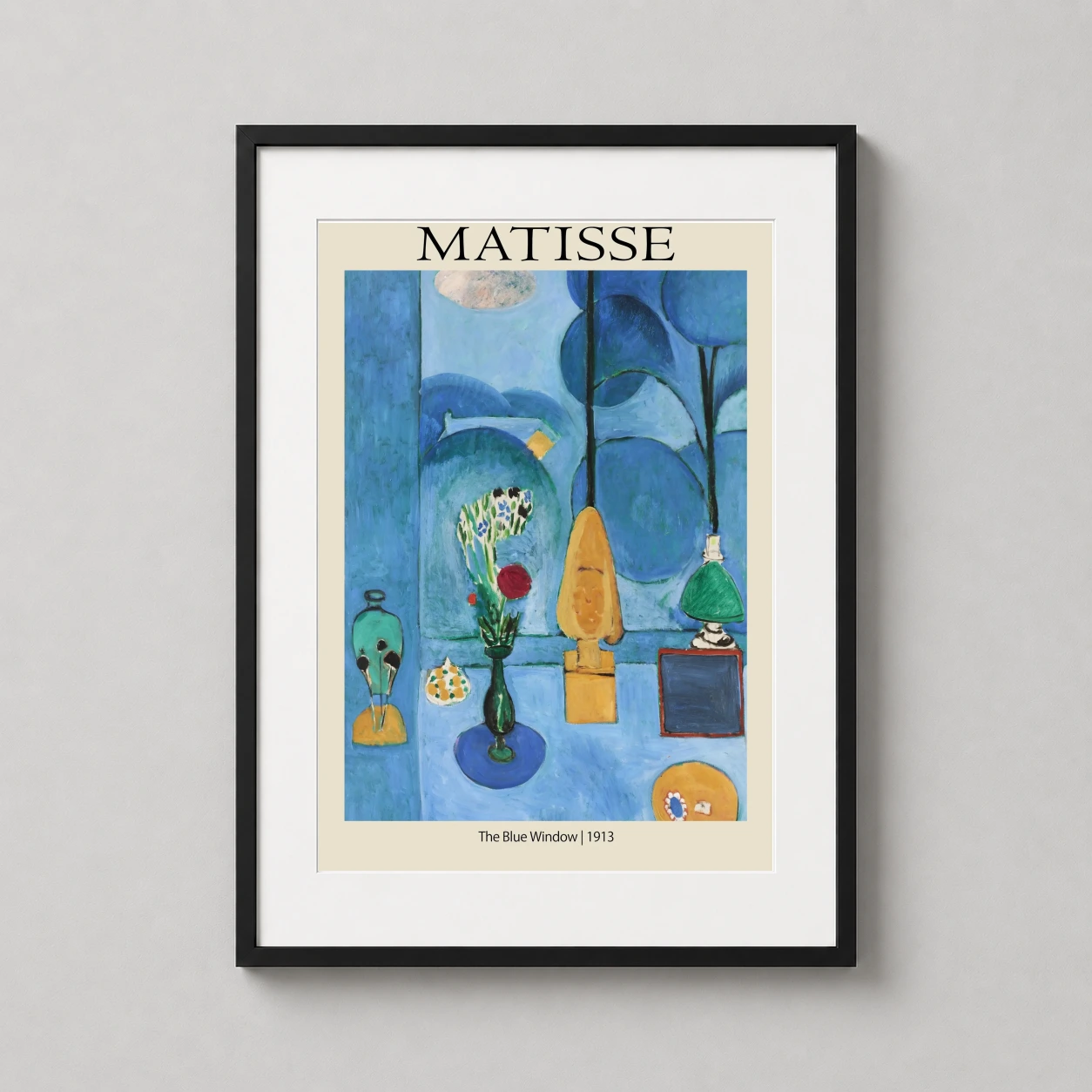 Room mockup of Henri Matisse The Blue Window 1913 Expressionist Art Print, displayed as framed wall art in a living room setting as a portrait print with blue, teal, and red tones.