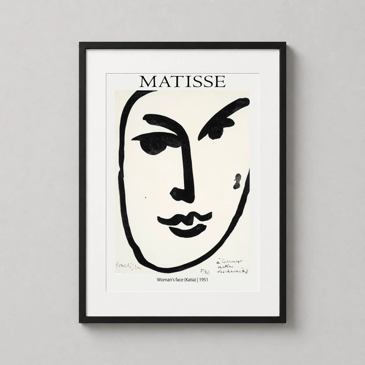 Room mockup of Matisse Katia Woman's Face Minimalist Exhibition Art Print, displayed as framed wall art in a living room setting as a portrait print with black and white tones.
