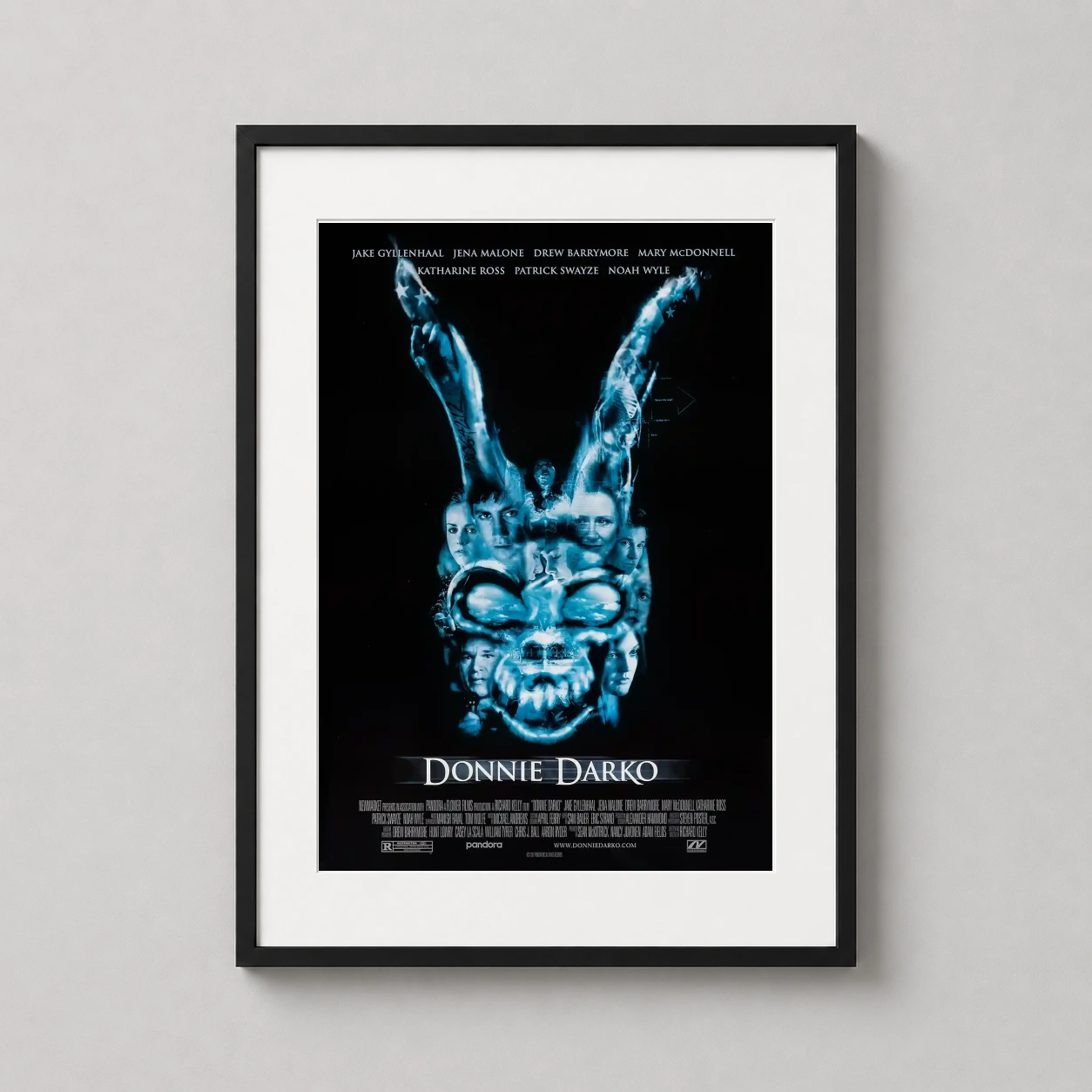 Donnie Darko — this Donnie Darko poster features a dark blue composite image of the