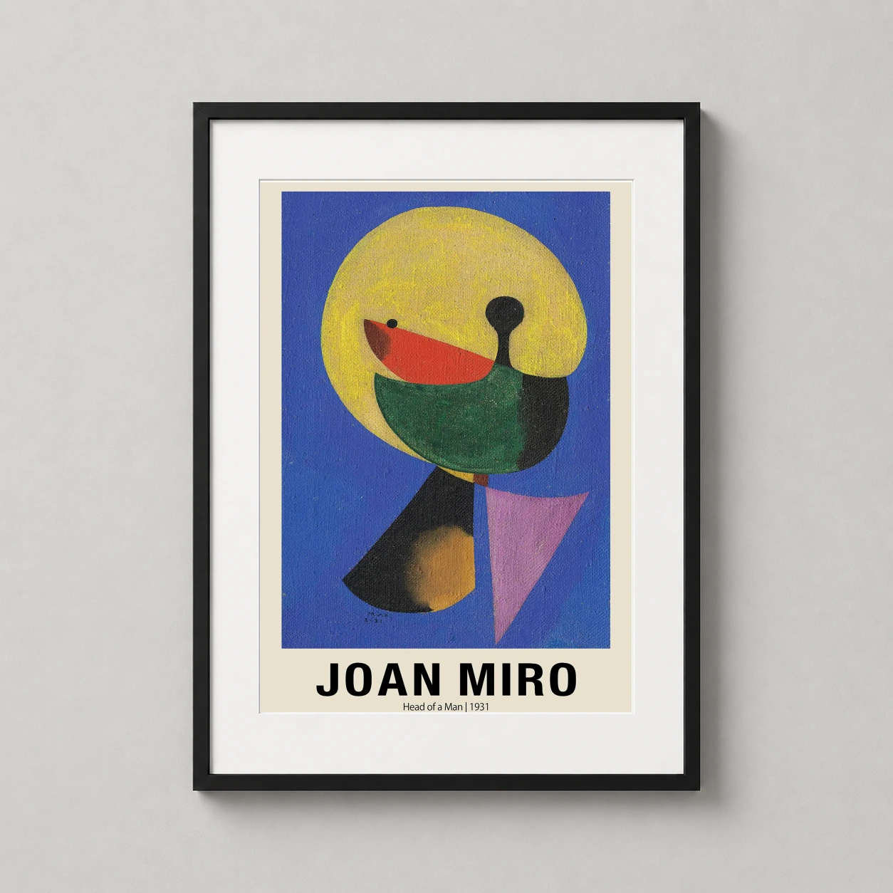 Room mockup of Joan Miro Head of a Man 1931 Surrealist Abstract Art Print, displayed as framed wall art in a living room setting as a portrait print with blue and yellow tones.